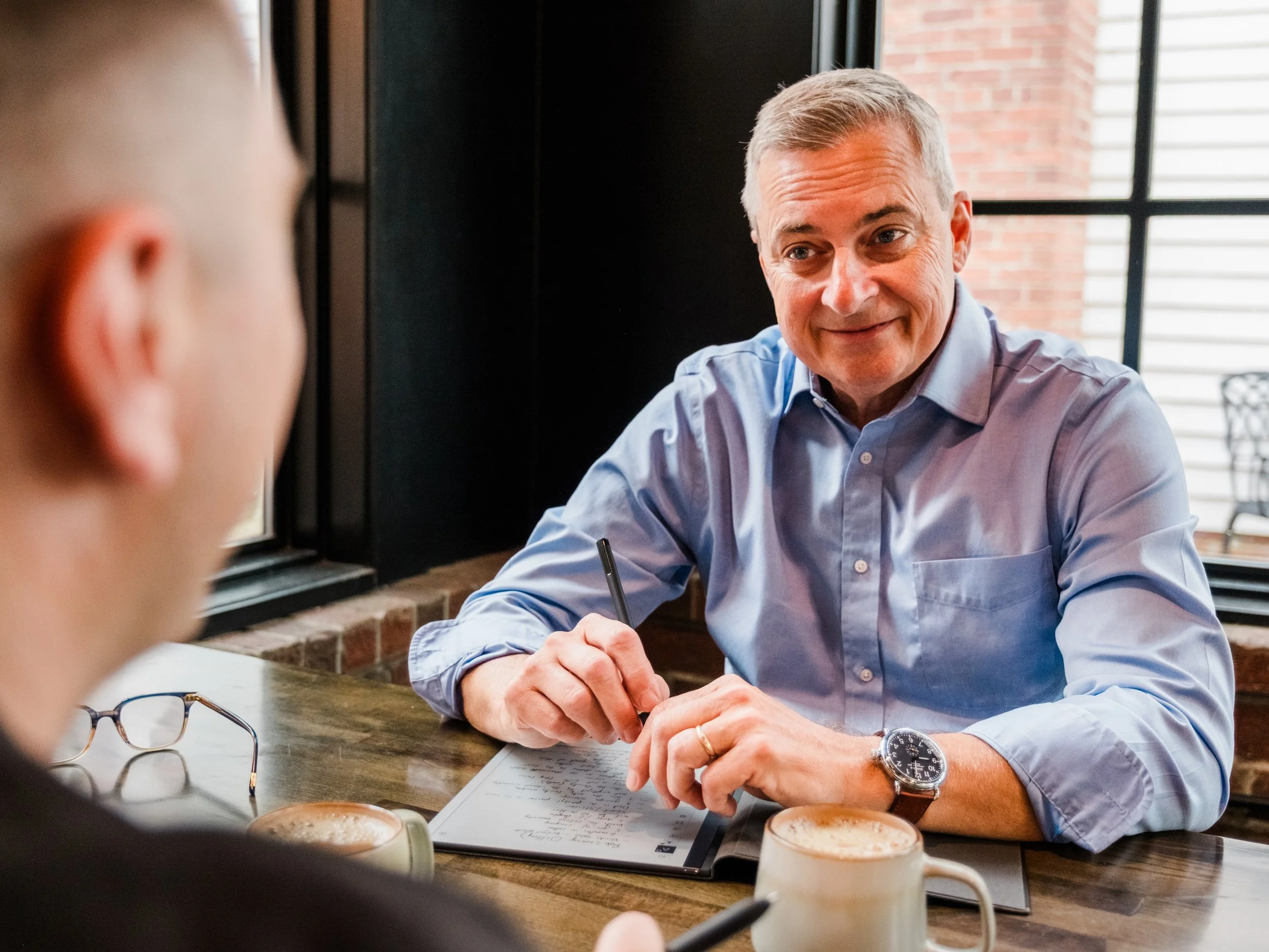 Jeff Fry meeting one-on-one with a coaching client during an executive coaching session.