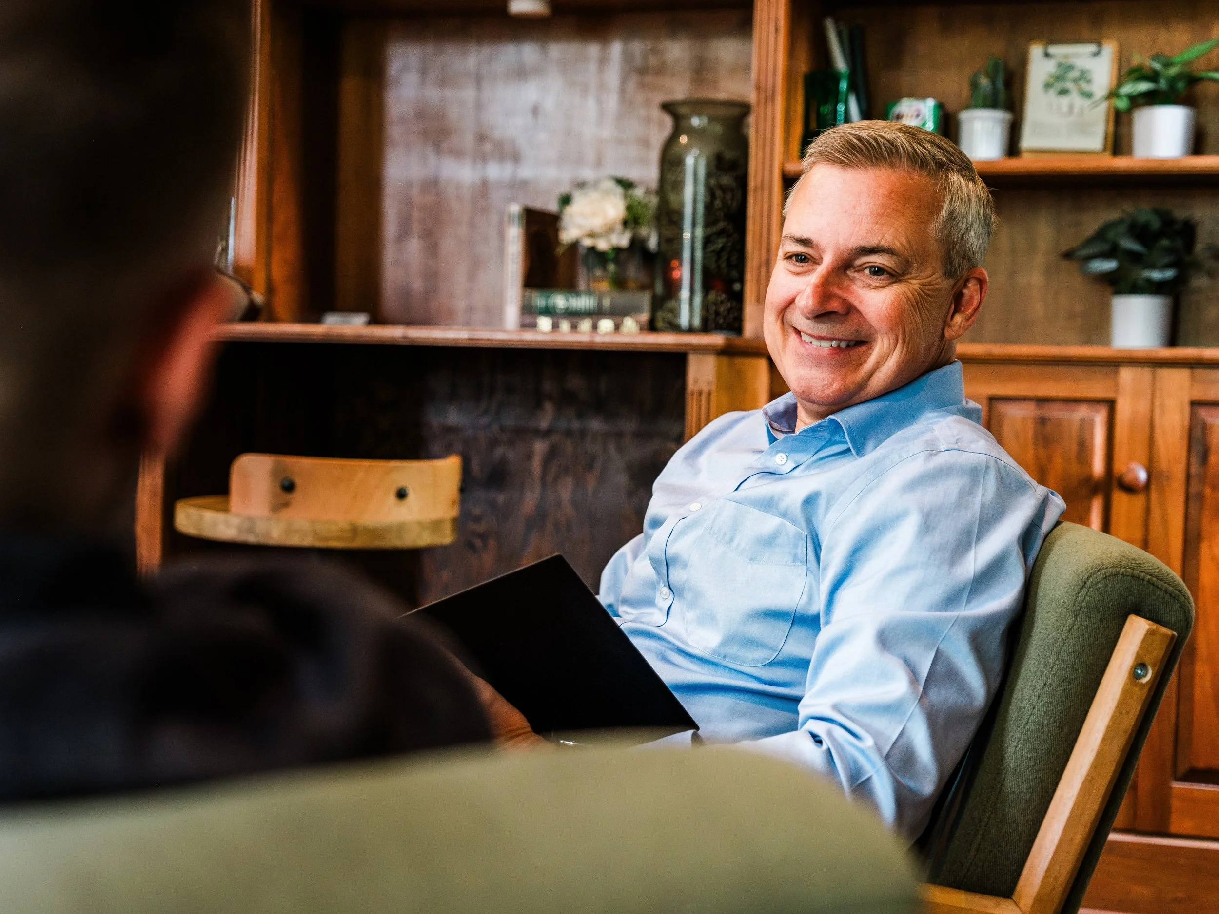 Jeff Fry listening during an executive coaching conversation with a client.