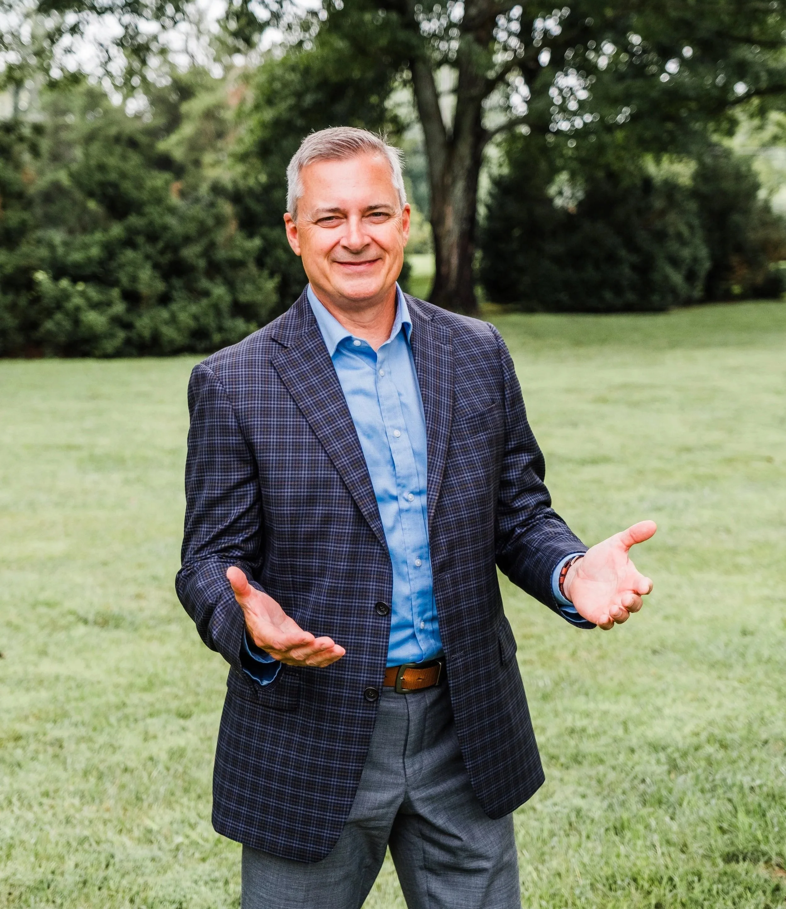 Executive coach Jeff Fry standing outside with an open, welcoming posture.