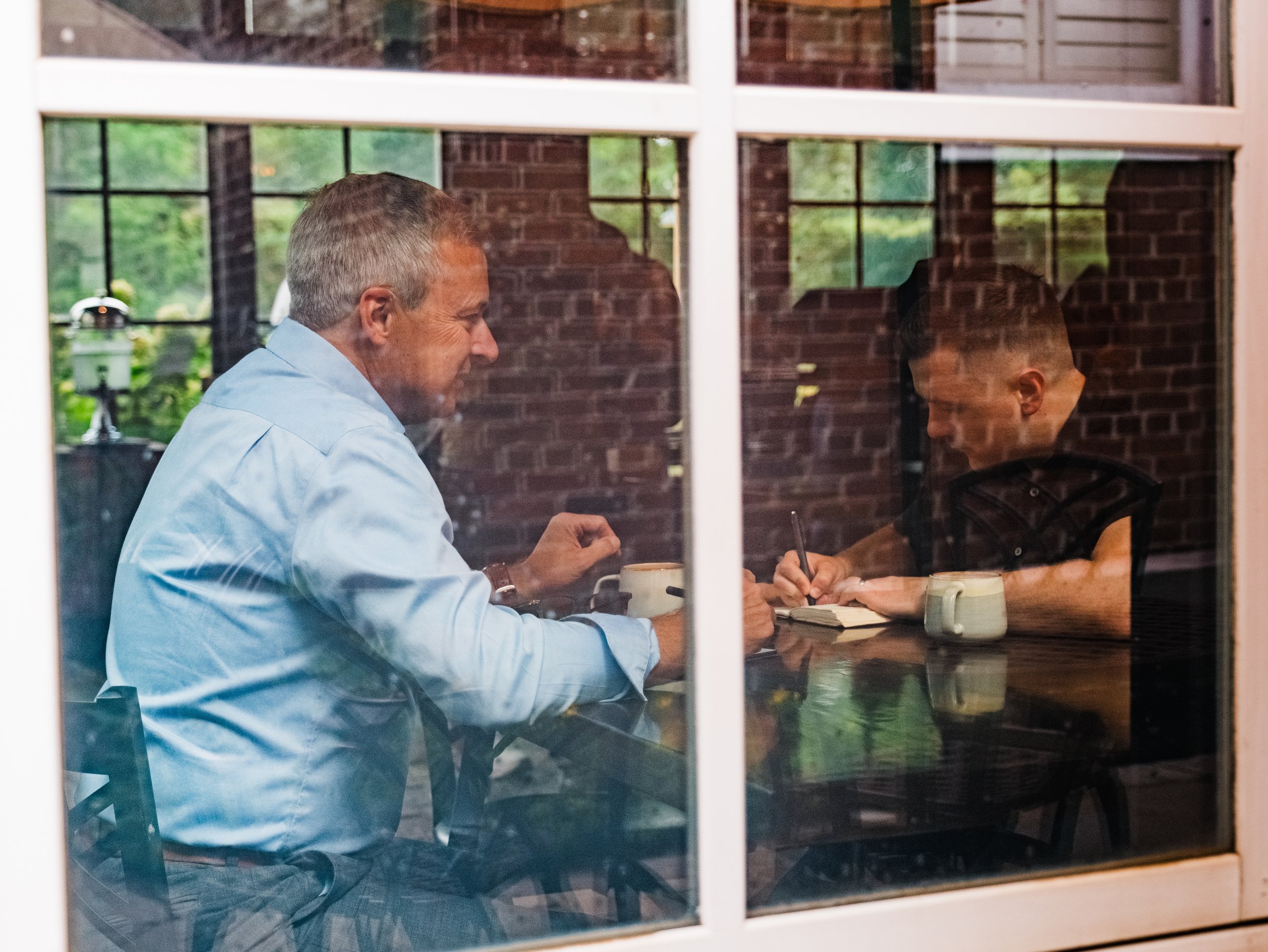 Jeff Fry coaching a client during a one-on-one executive coaching meeting.