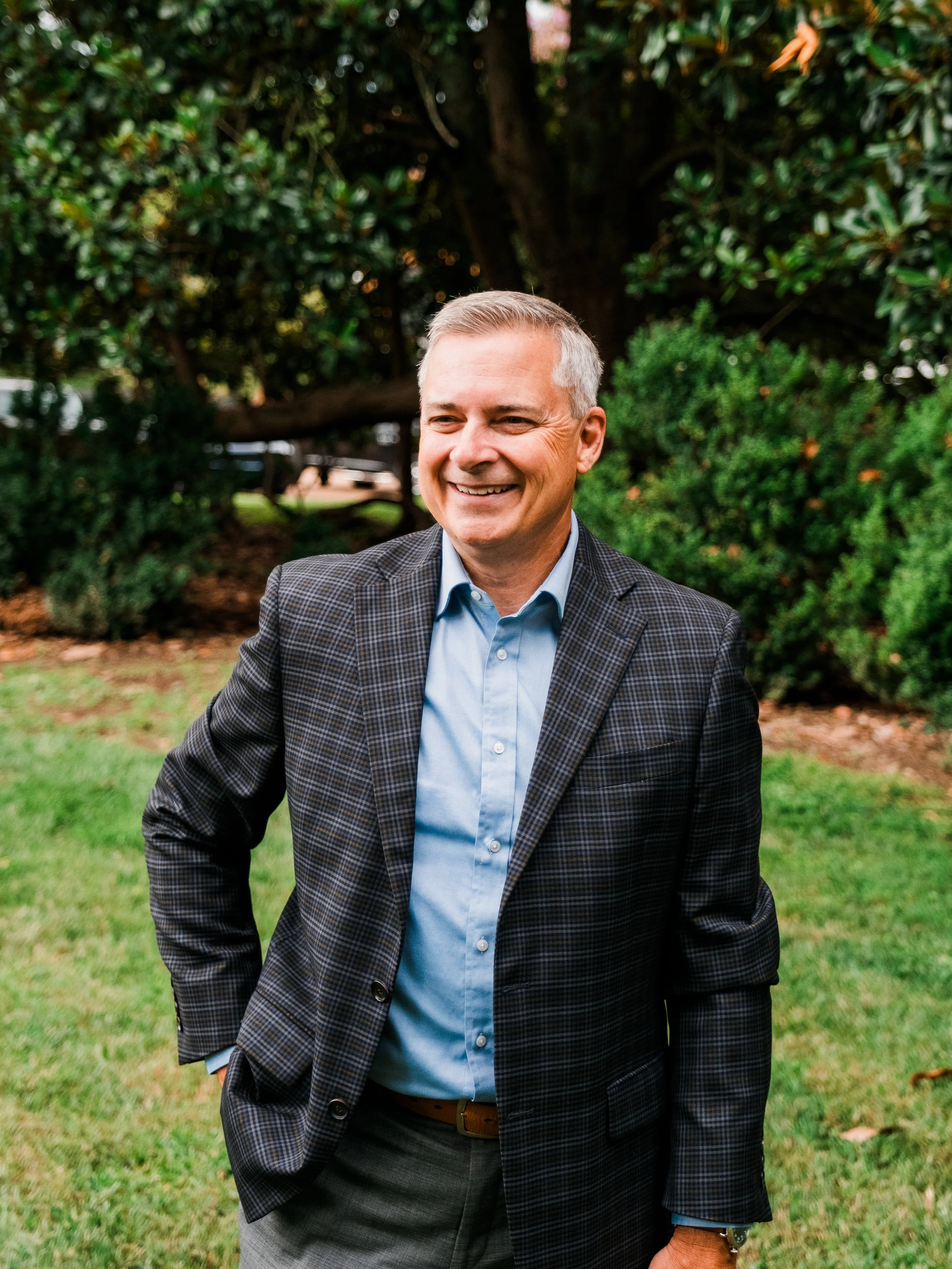 Executive coach Jeff Fry smiling outdoors, helping professionals gain clarity, confidence, and leadership growth.