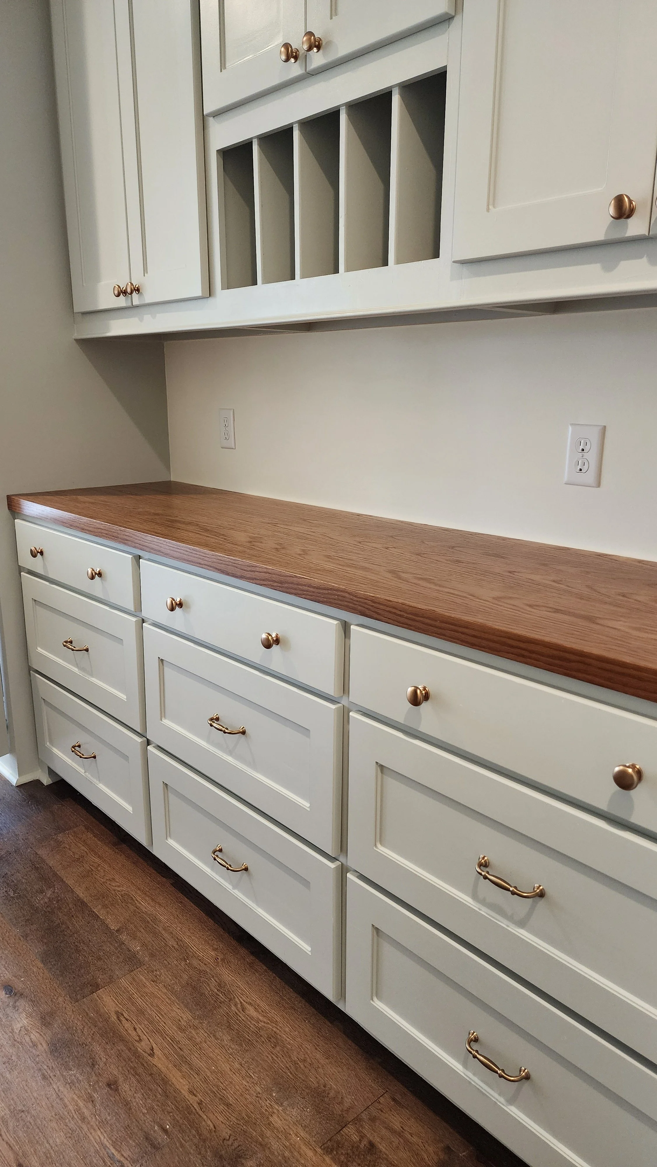 white cabinetry with butcher block counter top