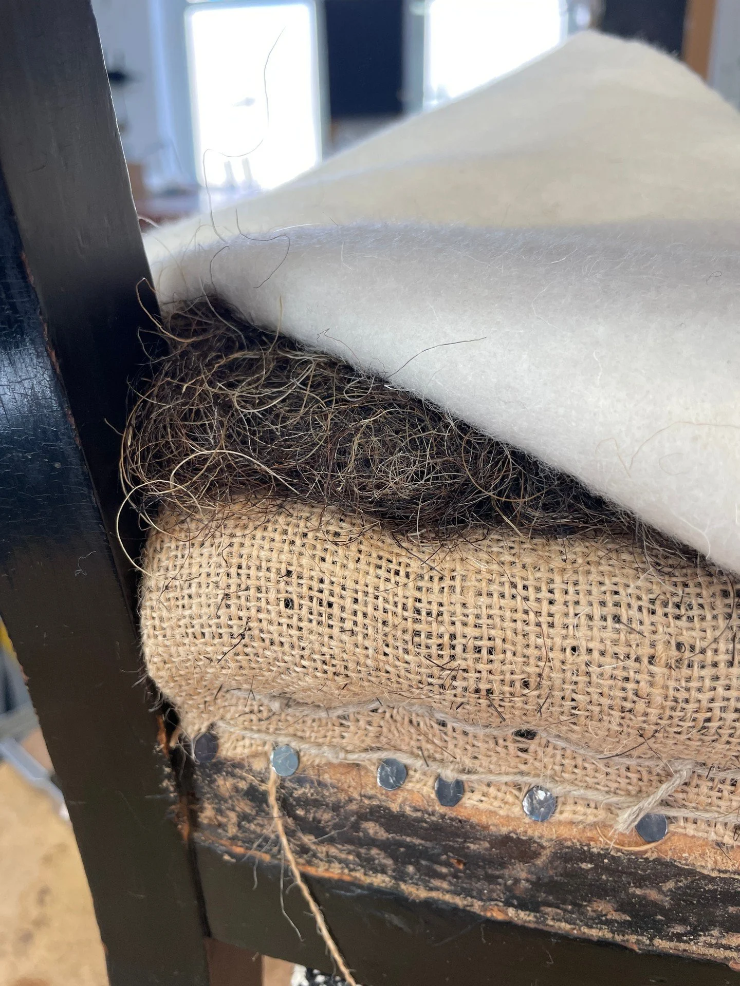Another layer of horsehair, a layer of WoolSafe barrier cloth all smoothed down with a layer of calico.

#upholstery
#upholsterylife
#traditionalupholstery