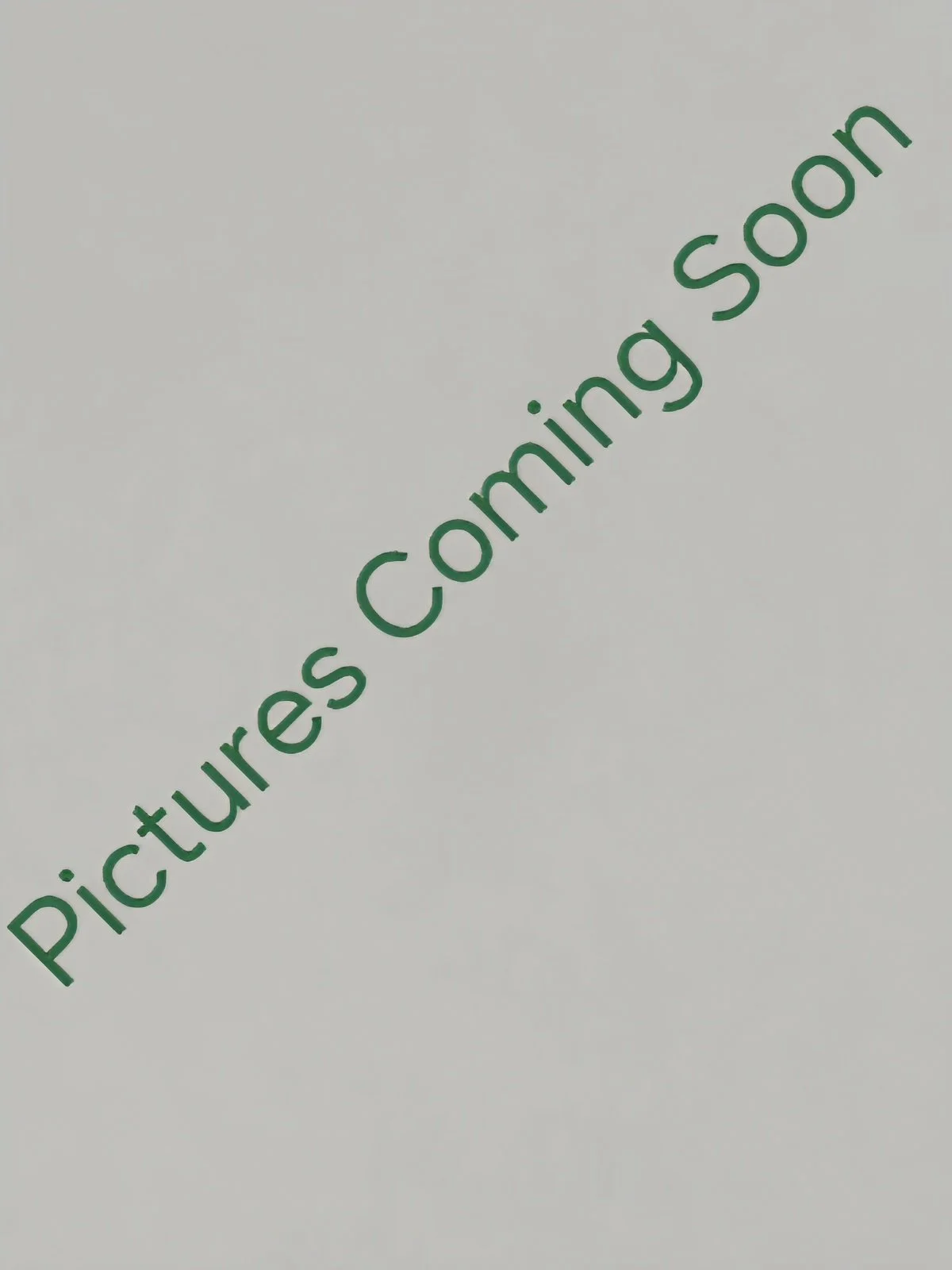 A plain white wall with vanity mirror text reading 'Pictures Coming Soon' in green letters diagonally across the image.