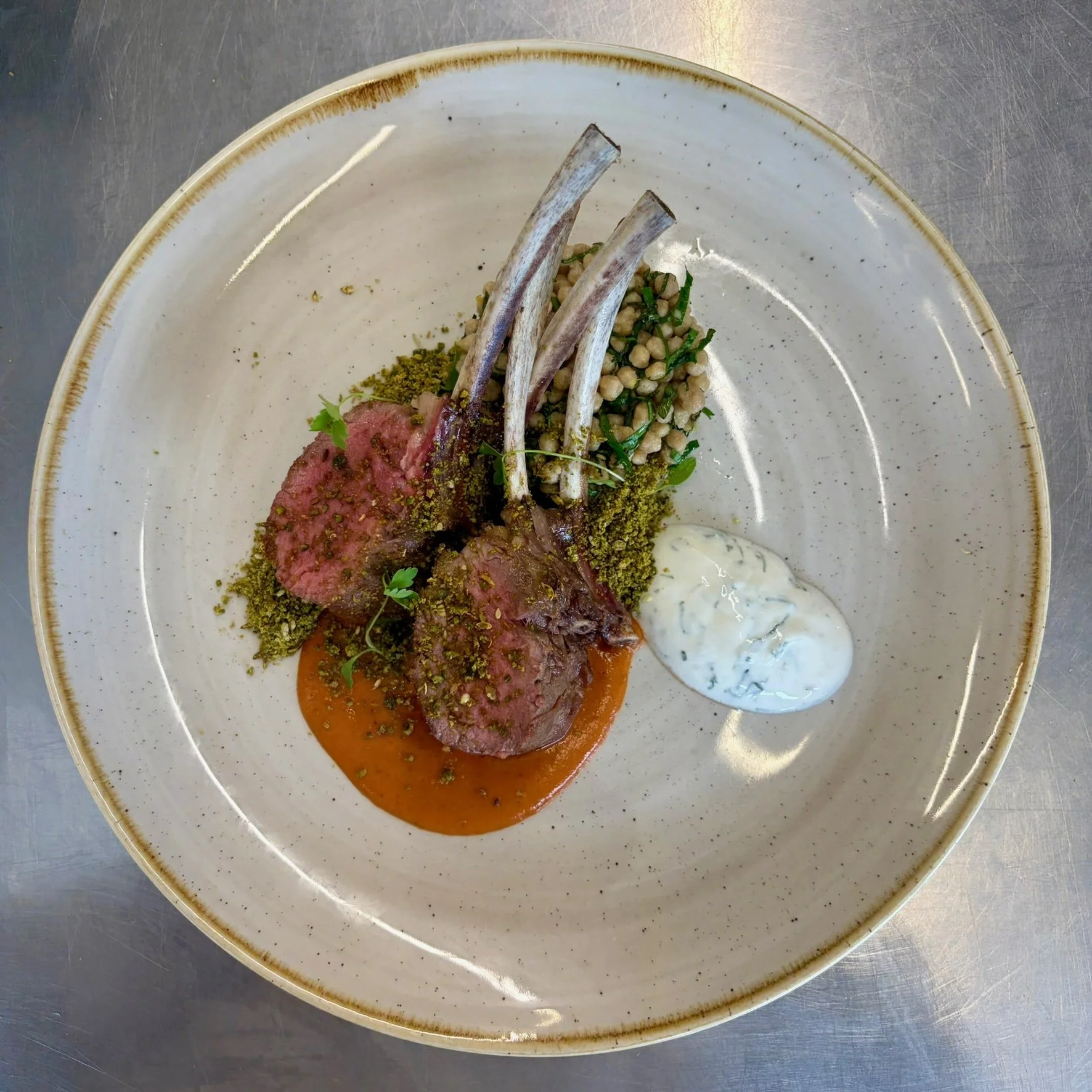 French trimmed lamb rack, maftoul, herby yoghurt, harissa and dukkah.jpeg