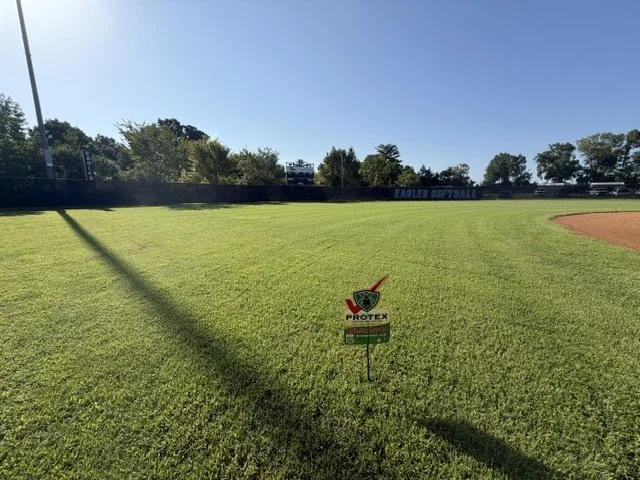 Grass with Protex sign