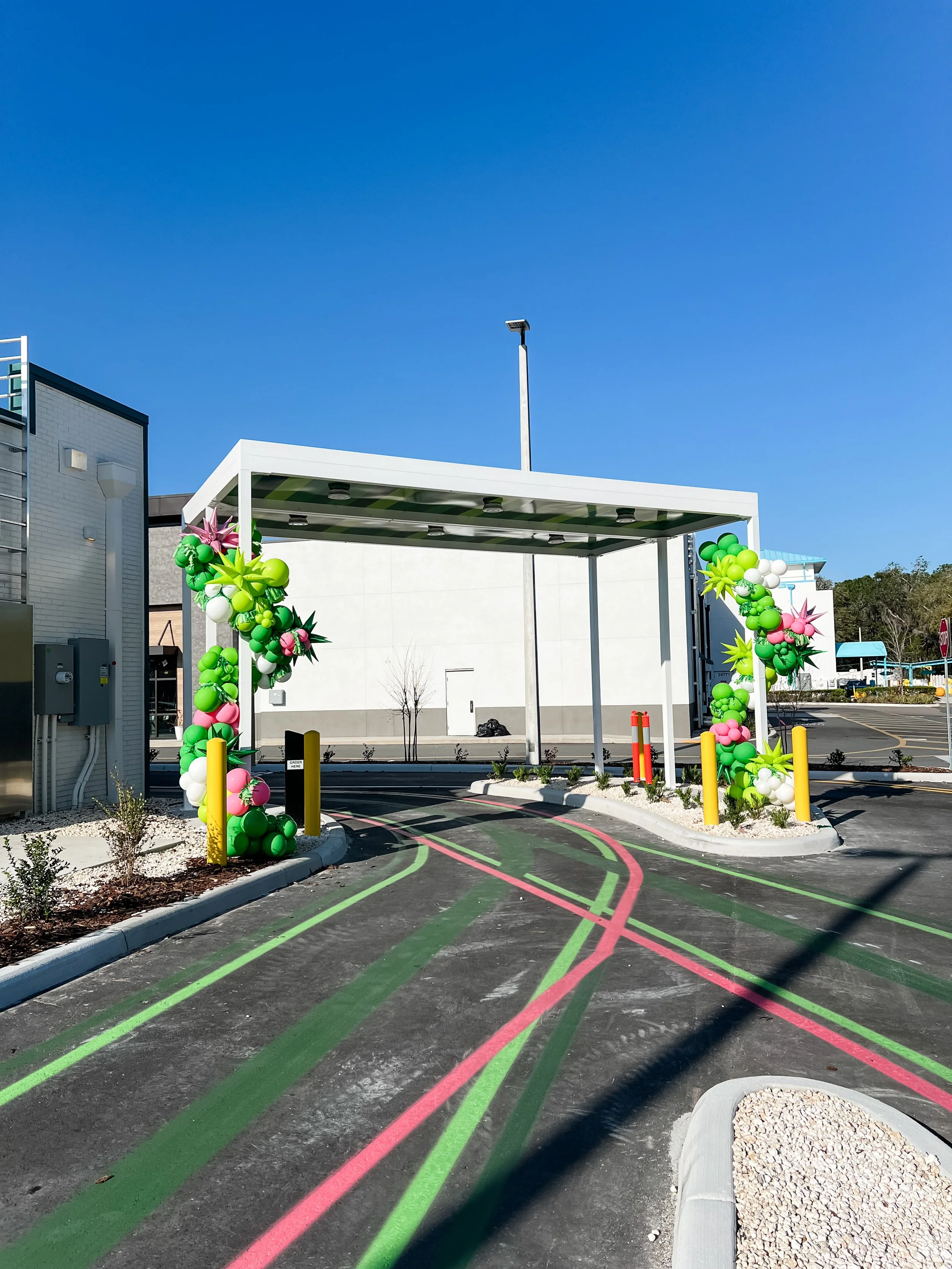 Balloon Garland to dress up the drive thru for Greenlane's new Lutz location!