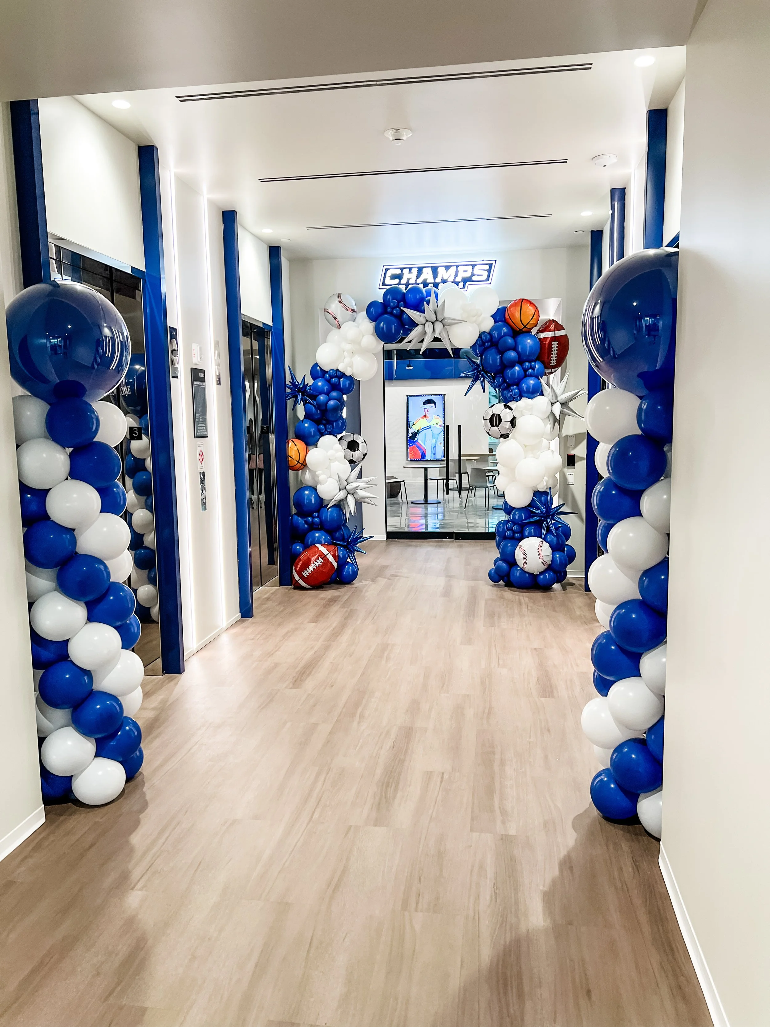 Traditional Spiral Balloons Columns and a Full Balloon Arch for Champs Sports' new headquarters opening! 