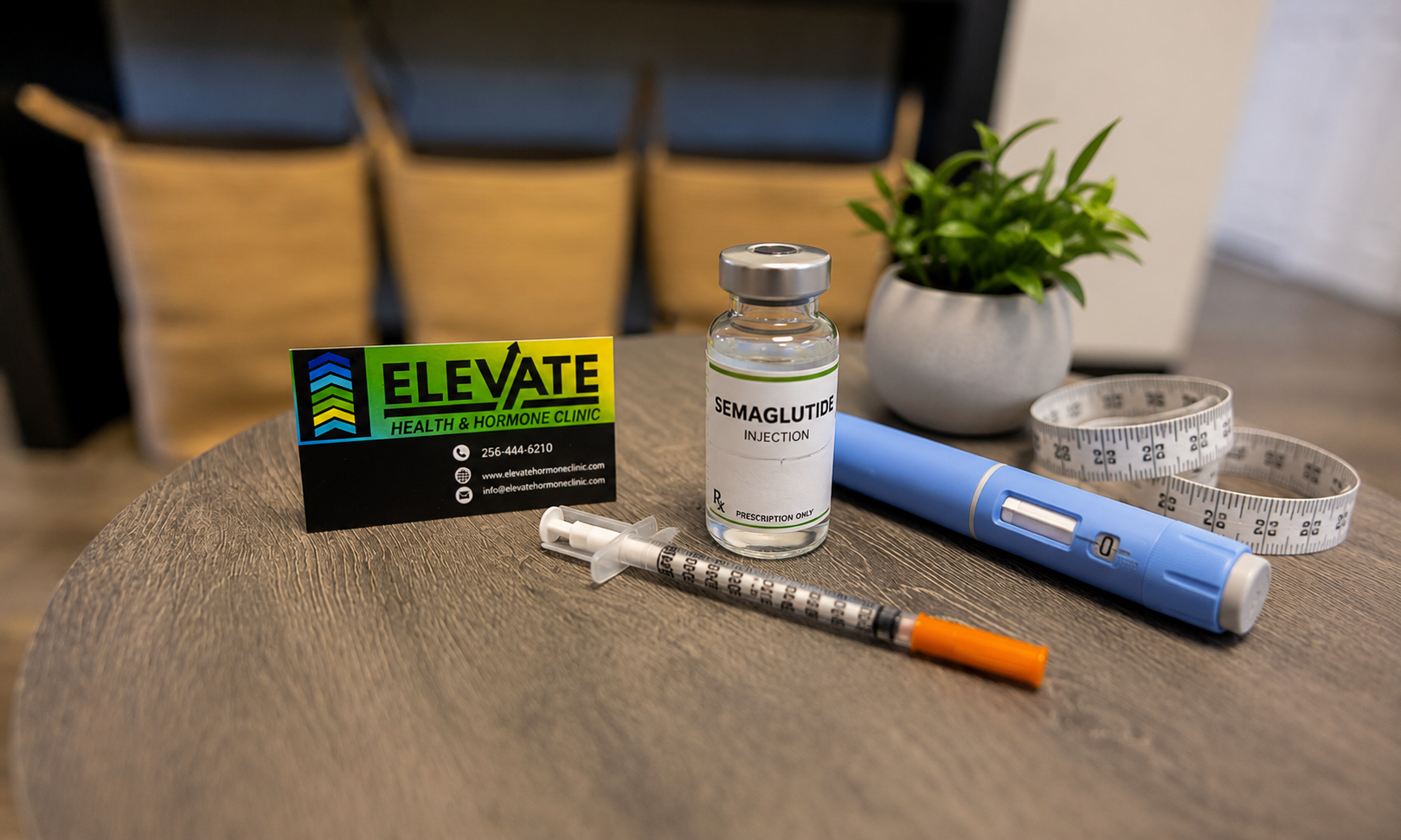 Medical syringe, vial labeled 'Semaglutide Injection', blue insulin pen, measuring tape, business card for Elevate Health & Hormone Clinic, and a potted plant on a wooden table.