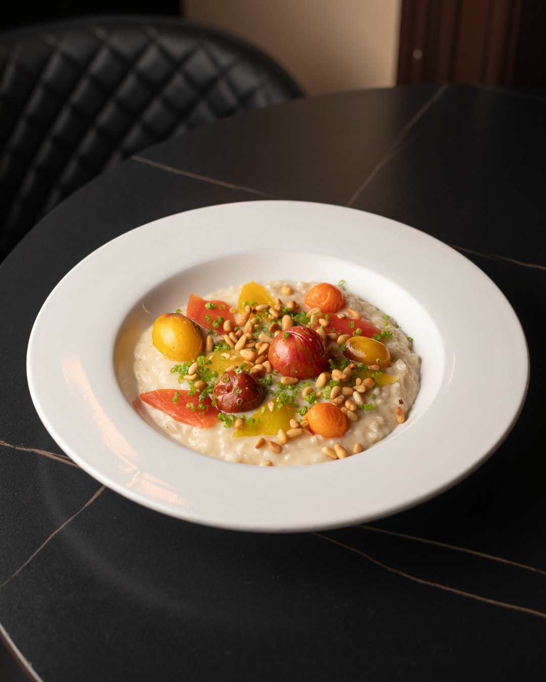 Meet our Heirloom Tomato Risotto. 🍅 Made with mascarpone and Grana Padano, then topped with toasted pine nuts, it's comfort food dressed up for dinner.