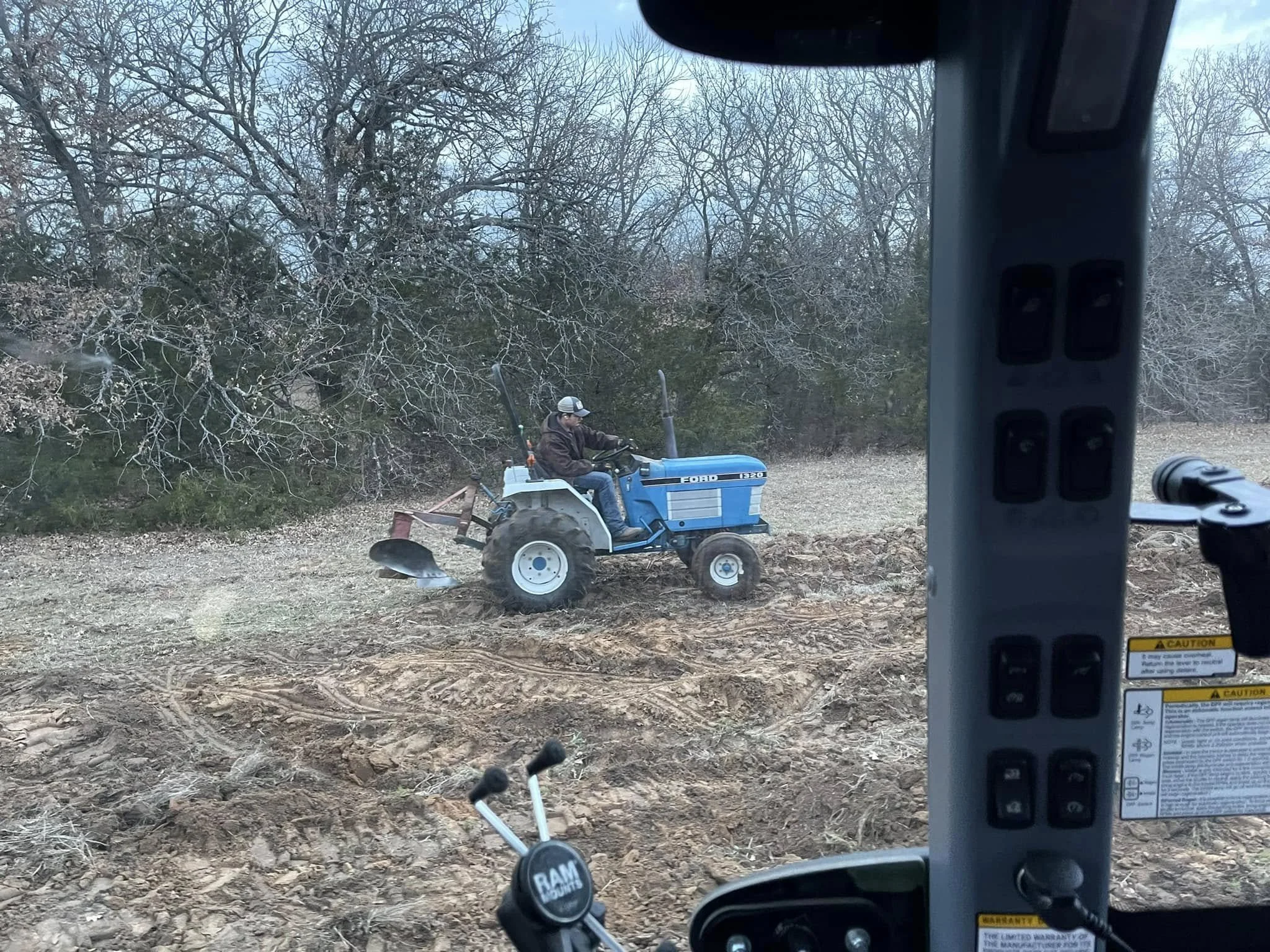 A person plowing a new garden plot in Gainesville Texas.