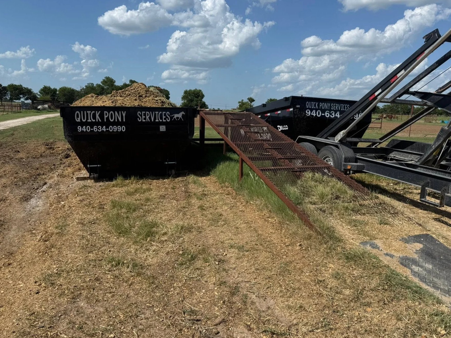 Quick Pony Services removing a horse manure stockpile with roll-off dumpsters in Gainesville, Texas