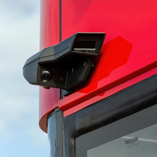 Bus operator using a Stoneridge MirrorEye interior camera monitor to view the vehicle side and surrounding roadway.