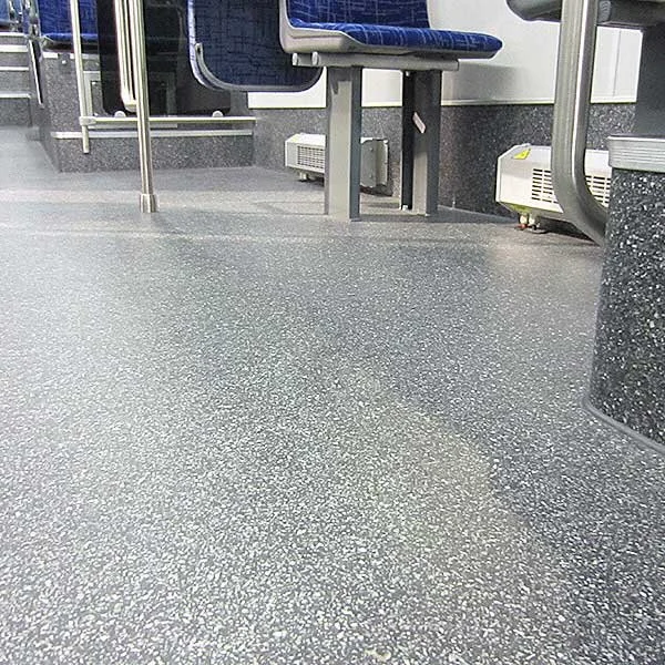 Gerflor TARABUS Apollo durable slip-resistant flooring installed throughout a modern transit bus interior.