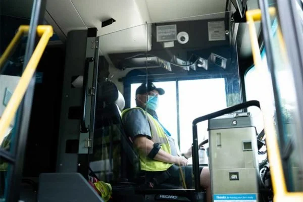 TransitGuard DriverBarrier protecting a transit bus operator while preserving visibility and access.