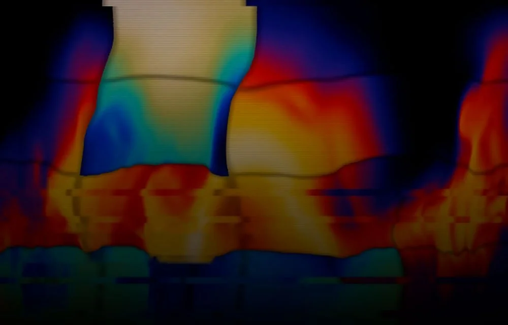 Thermal imaging view showing heat patterns used to detect abnormal temperatures and potential fire risks on transit vehicles.