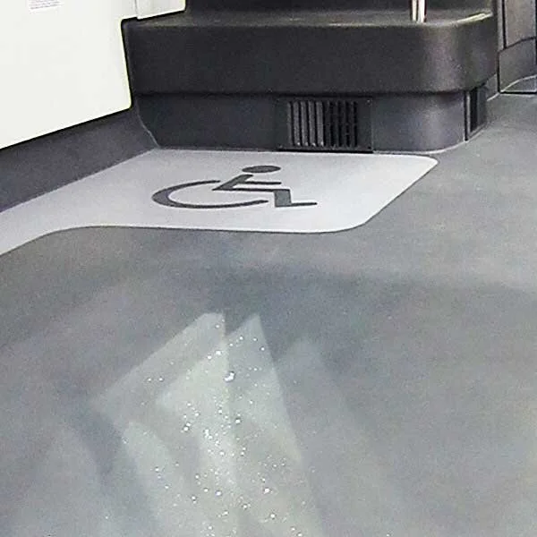 Gerflor TARABUS Sirius durable slip-resistant flooring installed throughout a modern transit bus interior.