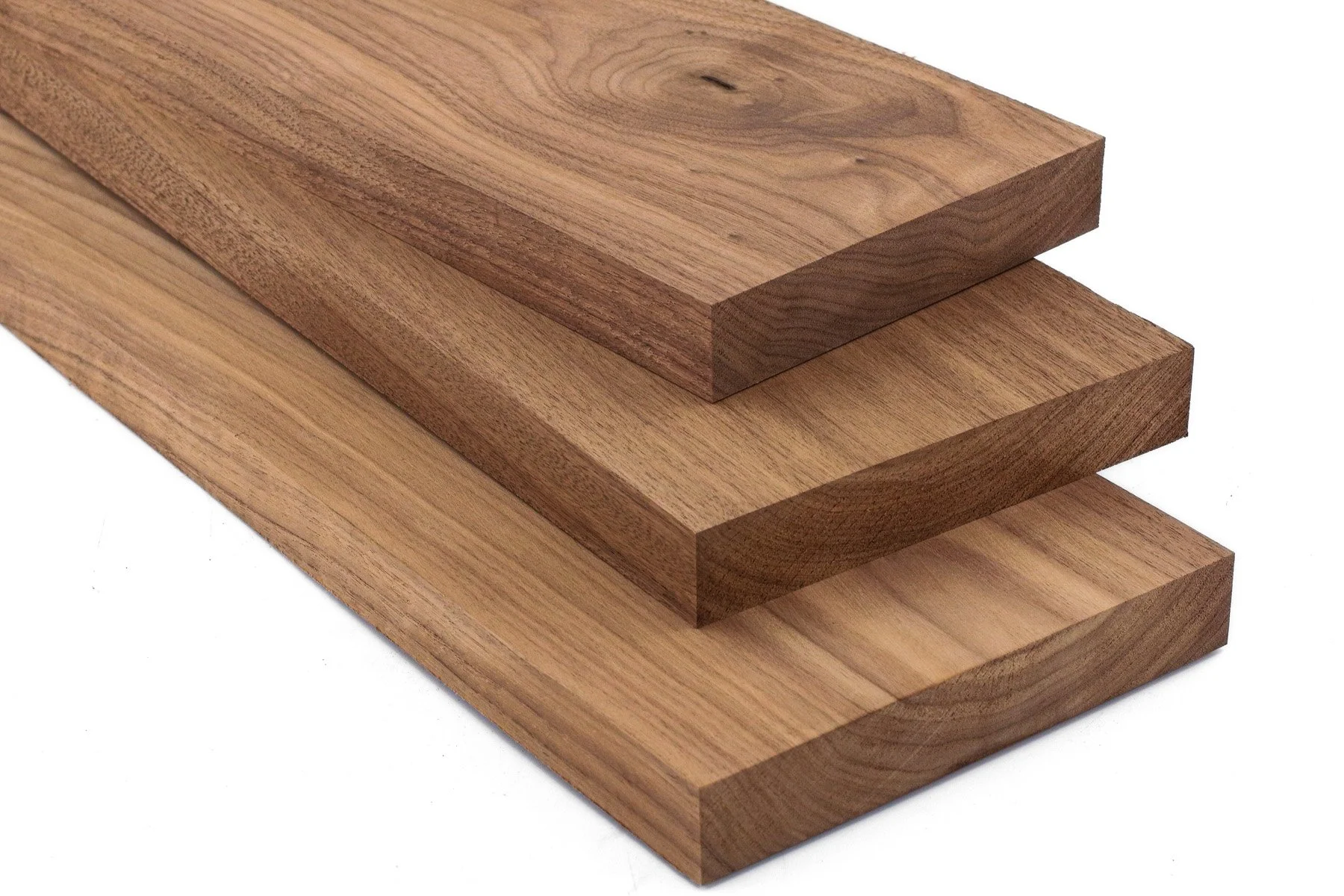 Stacked wooden planks of different shades of brown with visible wood grain.