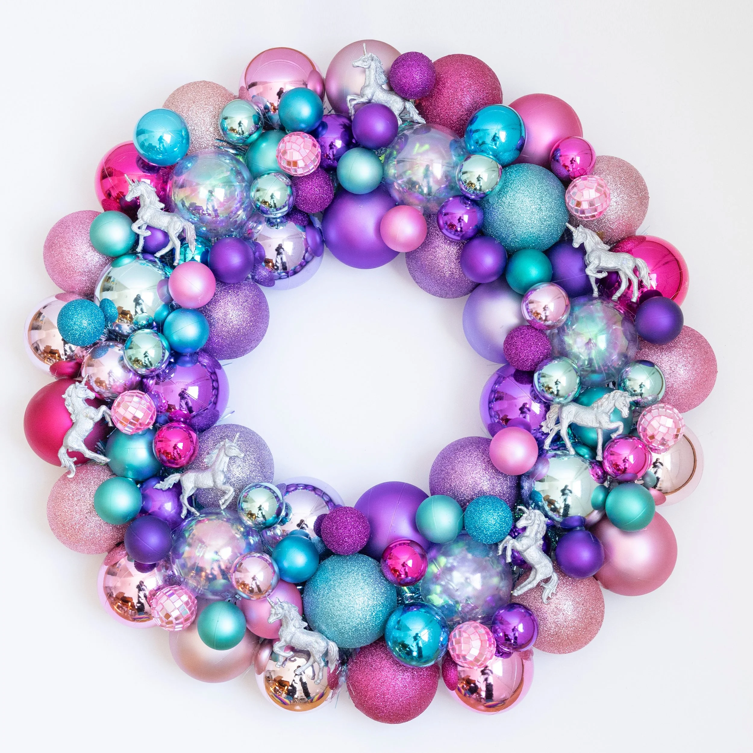 This is another unicorn wreath I made during the big snow storm. This one is mermaid colors (pink, purple, turquoise and iridescent ornaments) with unicorns that I hand-painted silver. I absolutely love this wreath and wish I had some place to hang i