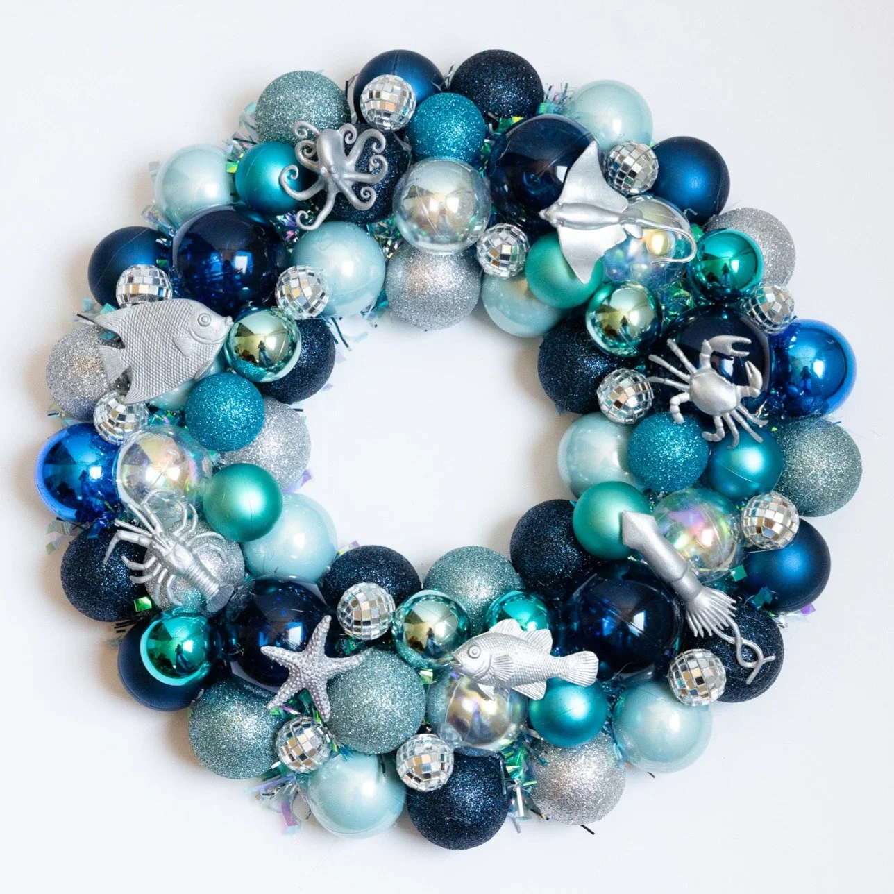 This is a wreath I made earlier this summer that celebrates the ocean! I decided to branch out (a bit) from sharks and whales to include some other sea creatures. This one's for sale on my site if anyone is interested - it would be great for a classr