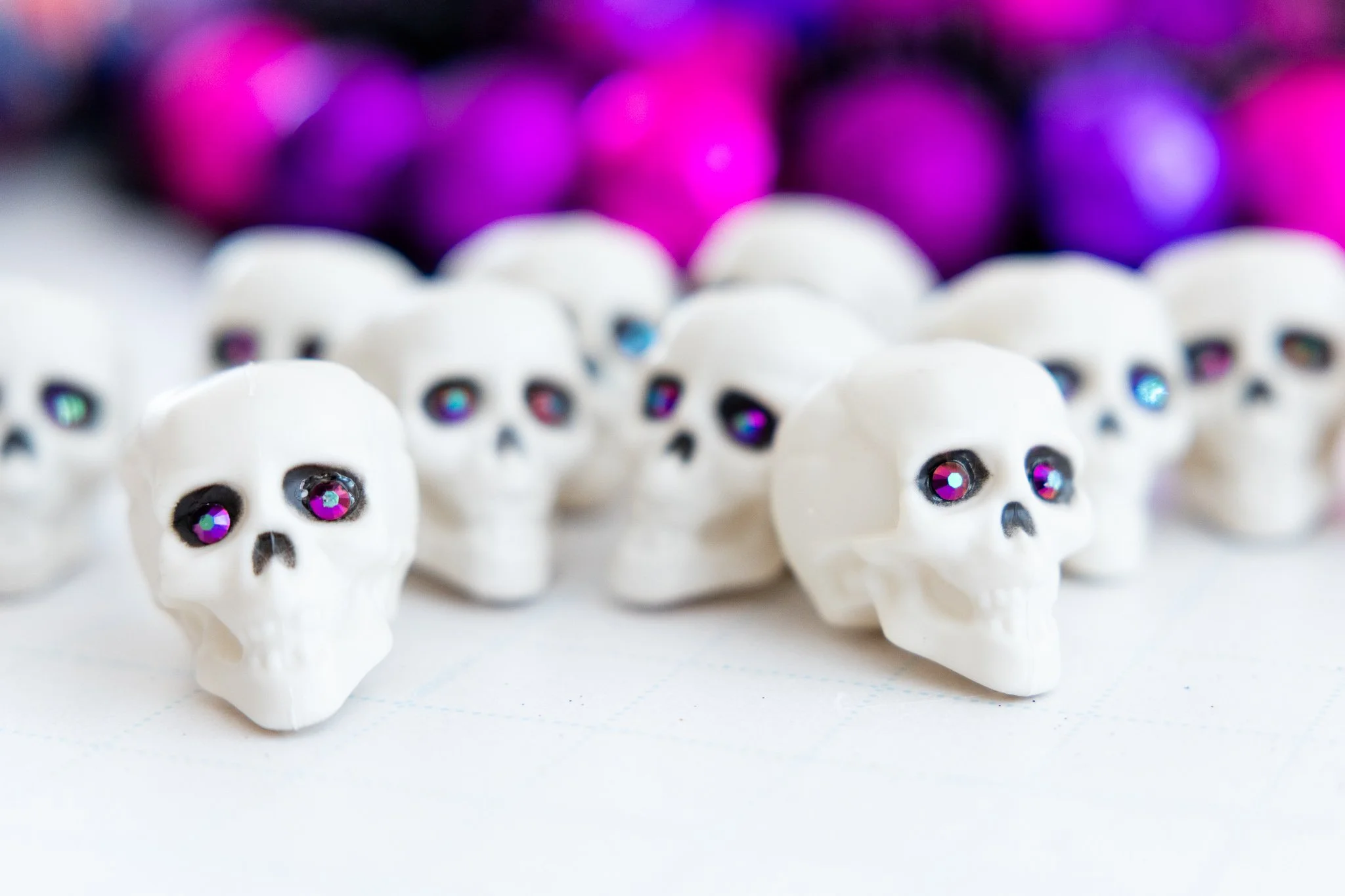 I've been wreathing up a storm over here, and am excited to start showing you Halloween wreaths! Here's a sneak peek of some skulls with gem eyes that I used for my absolute favorite Halloween wreath (I may just keep this one for myself). #HalloweenC