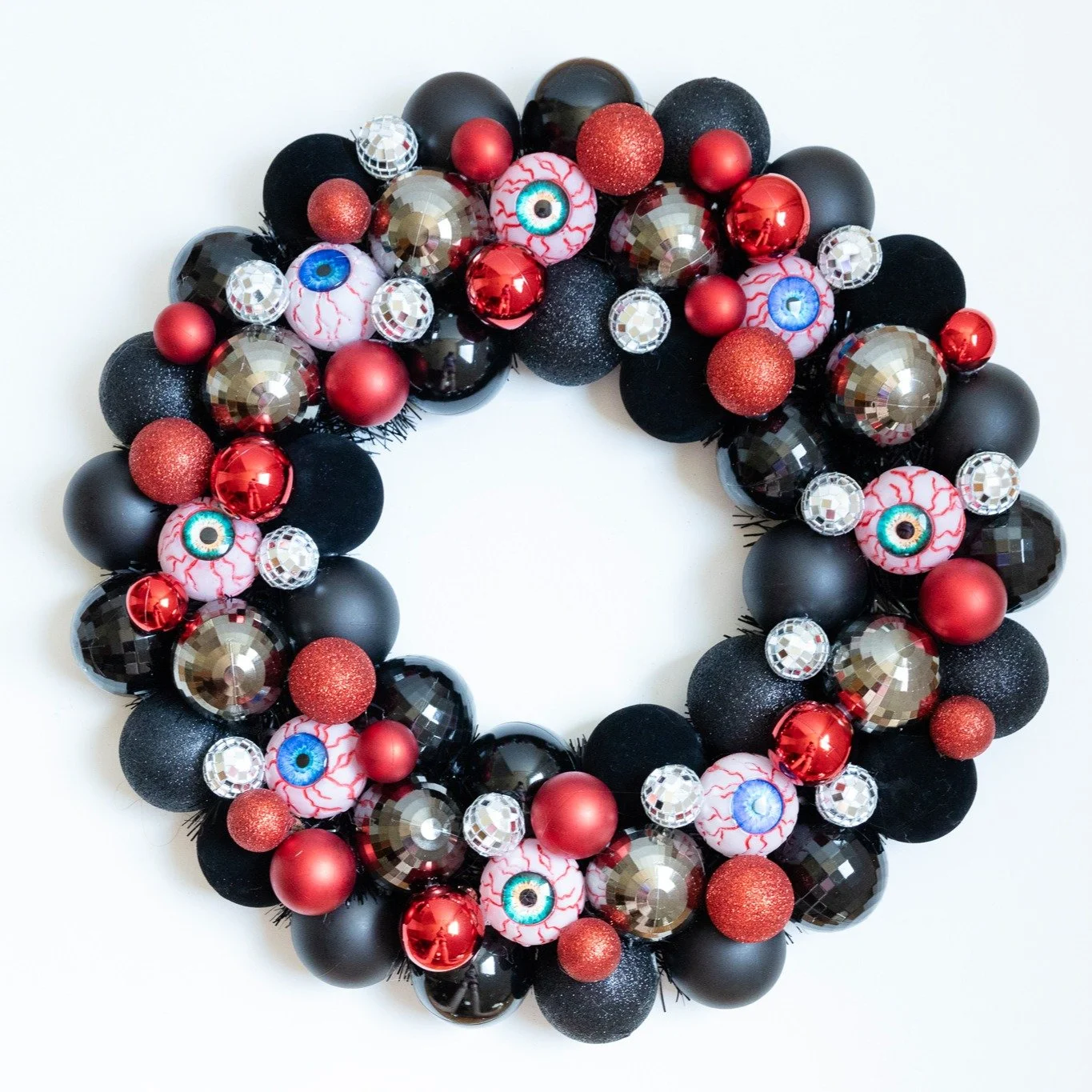 Let the Halloween wreath madness begin! I made a bunch of Halloween wreaths over the summer and while I love them all, this is definitely one of my favorites. I love it so much that I may just keep it for myself! It's got eyeballs AND disco balls! #h
