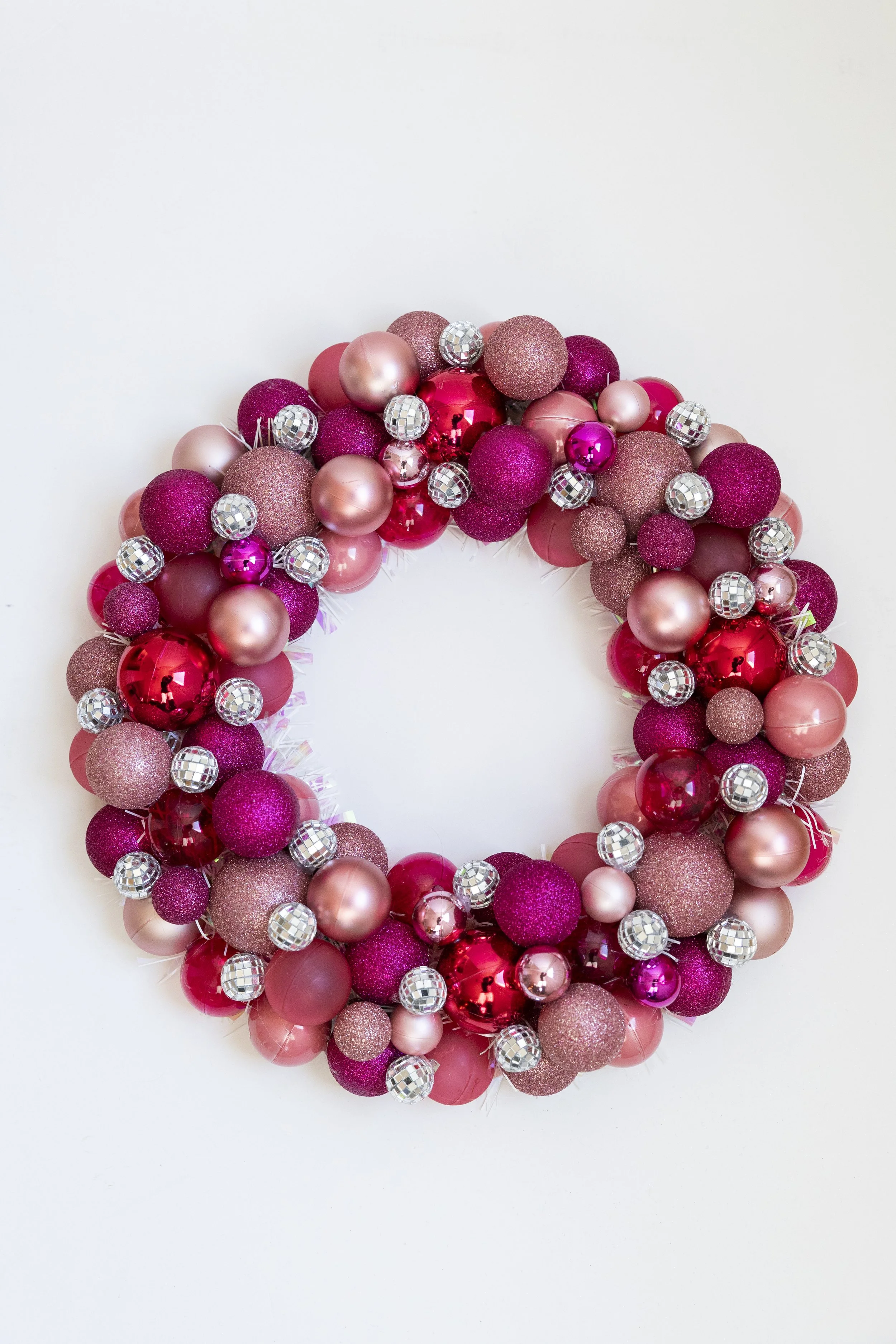 Shiny pink ornament wreath with disco balls