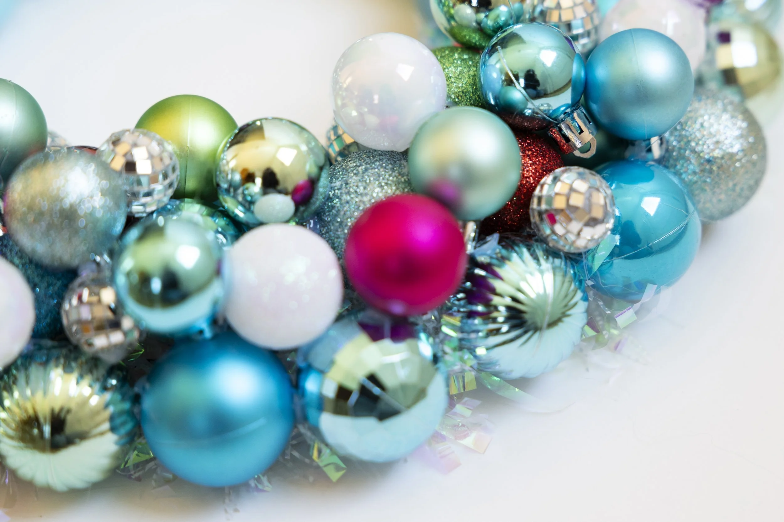 Colorful wreath made with turquoise, mint, white and hot pink ornaments