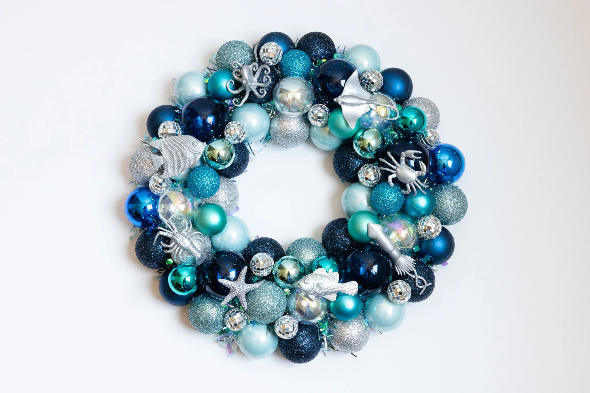 Handmade ocean ornament wreath with silver sea creatures and disco balls