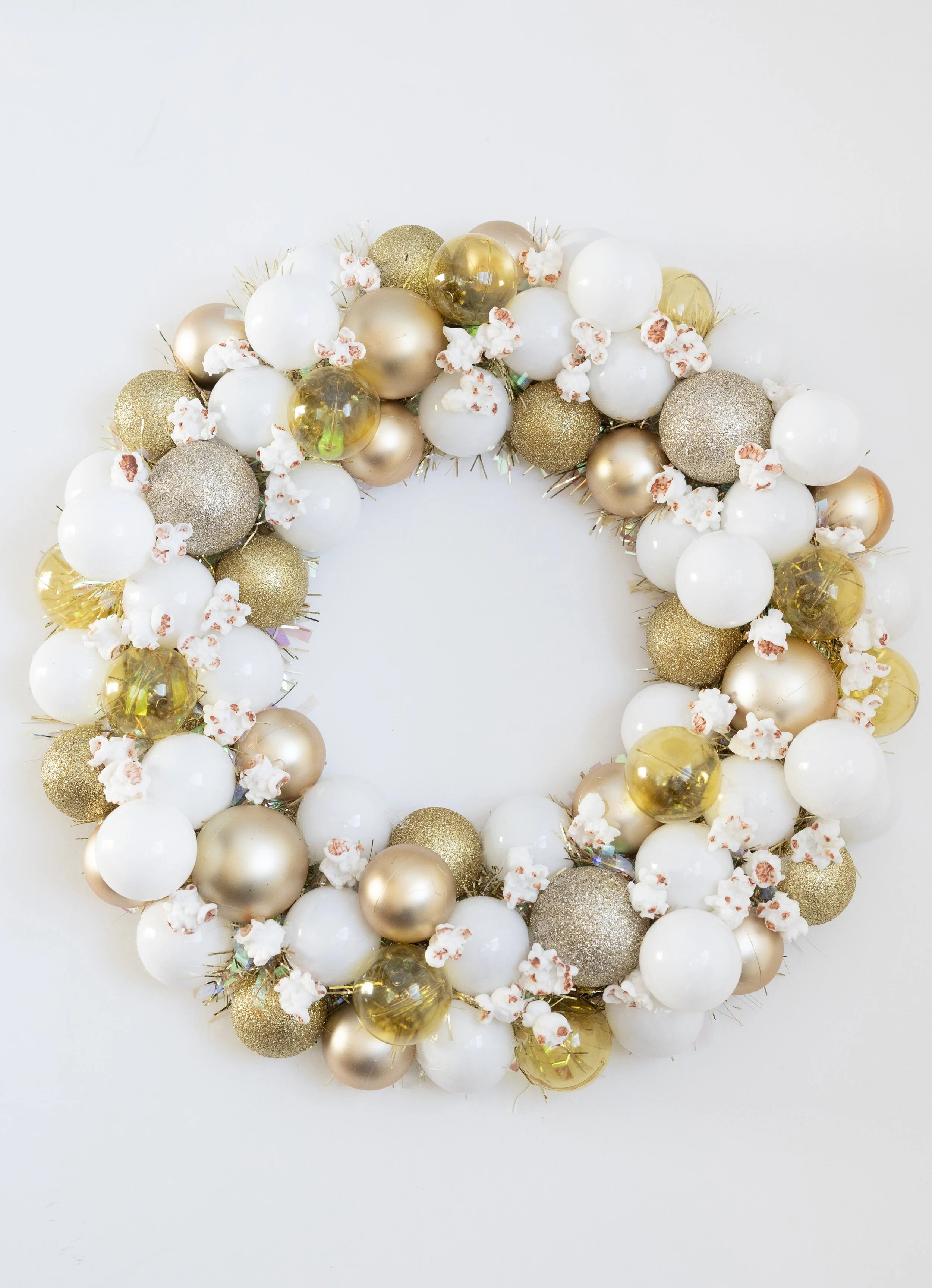 Handmade white and gold ornament wreath with popcorn