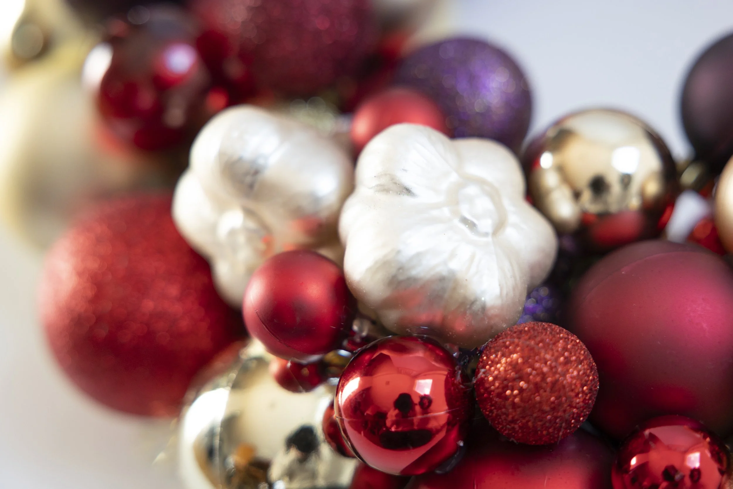 Garlic ornament on red, gold and purple ornament wreath