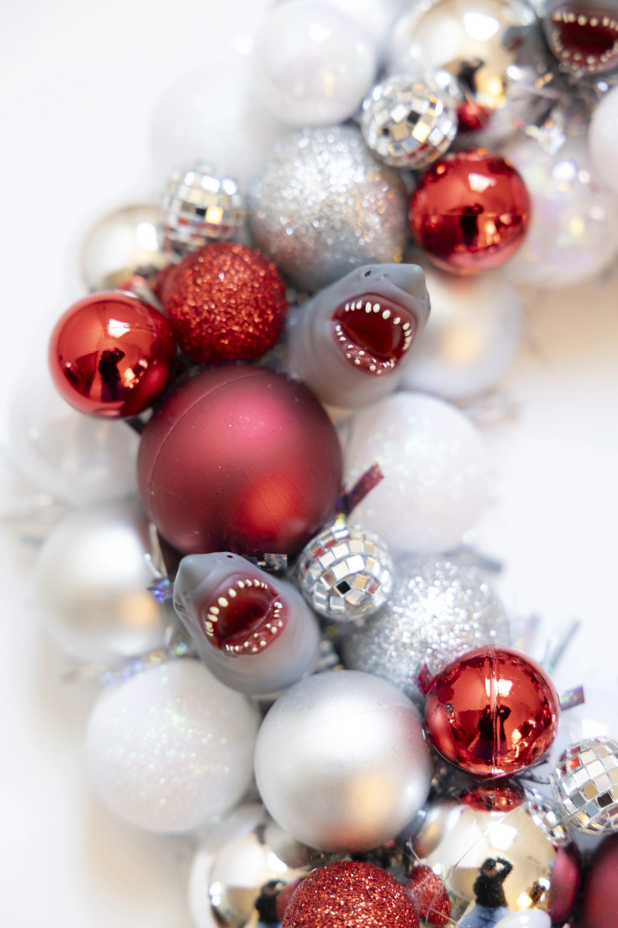 Shark wreath made from red, white and silver ornaments and disco balls