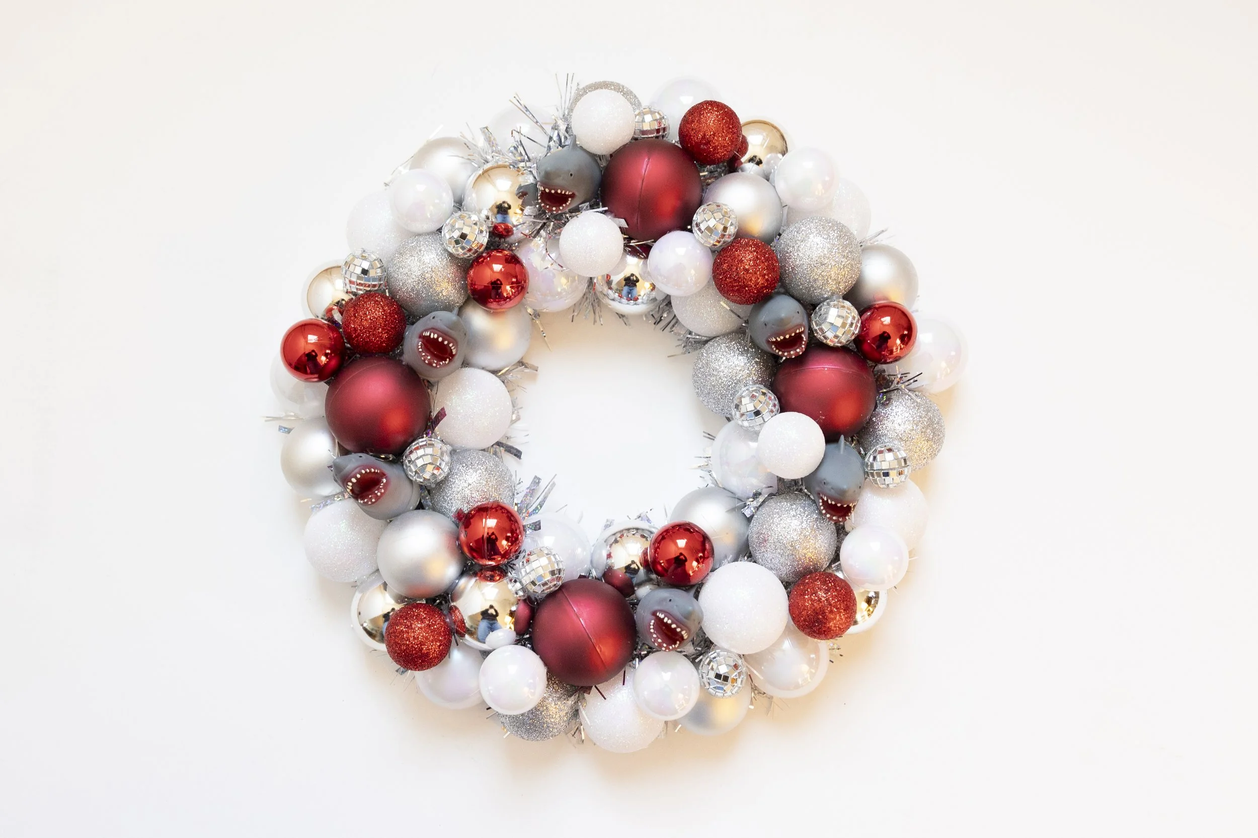 Red and white shark ornament wreath with disco balls