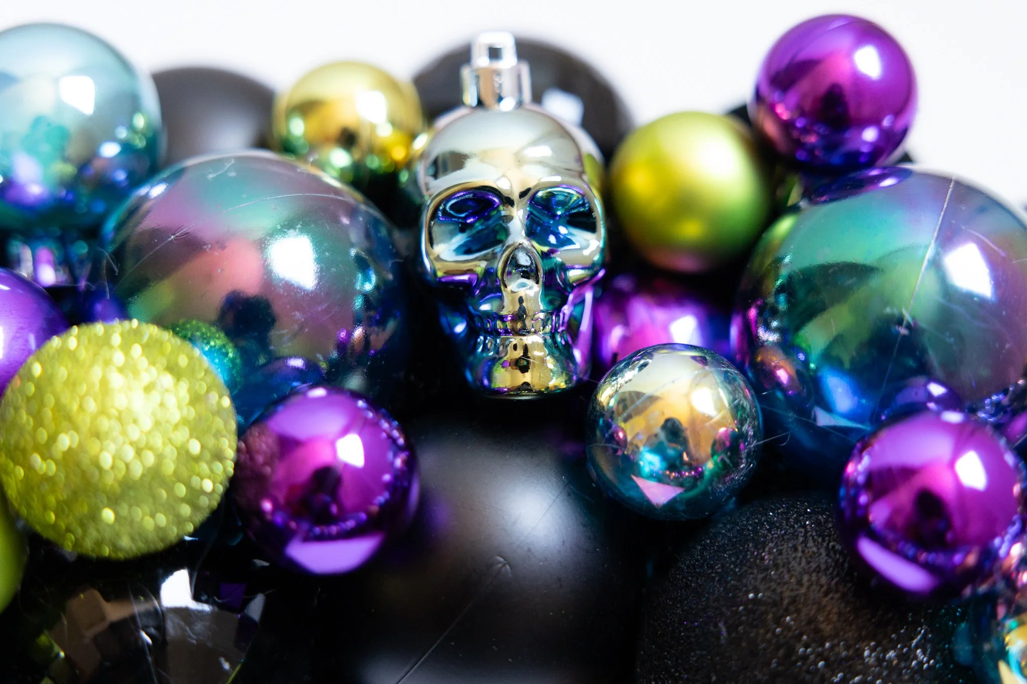 Iridescent skull ornament on a handmade Halloween wreath