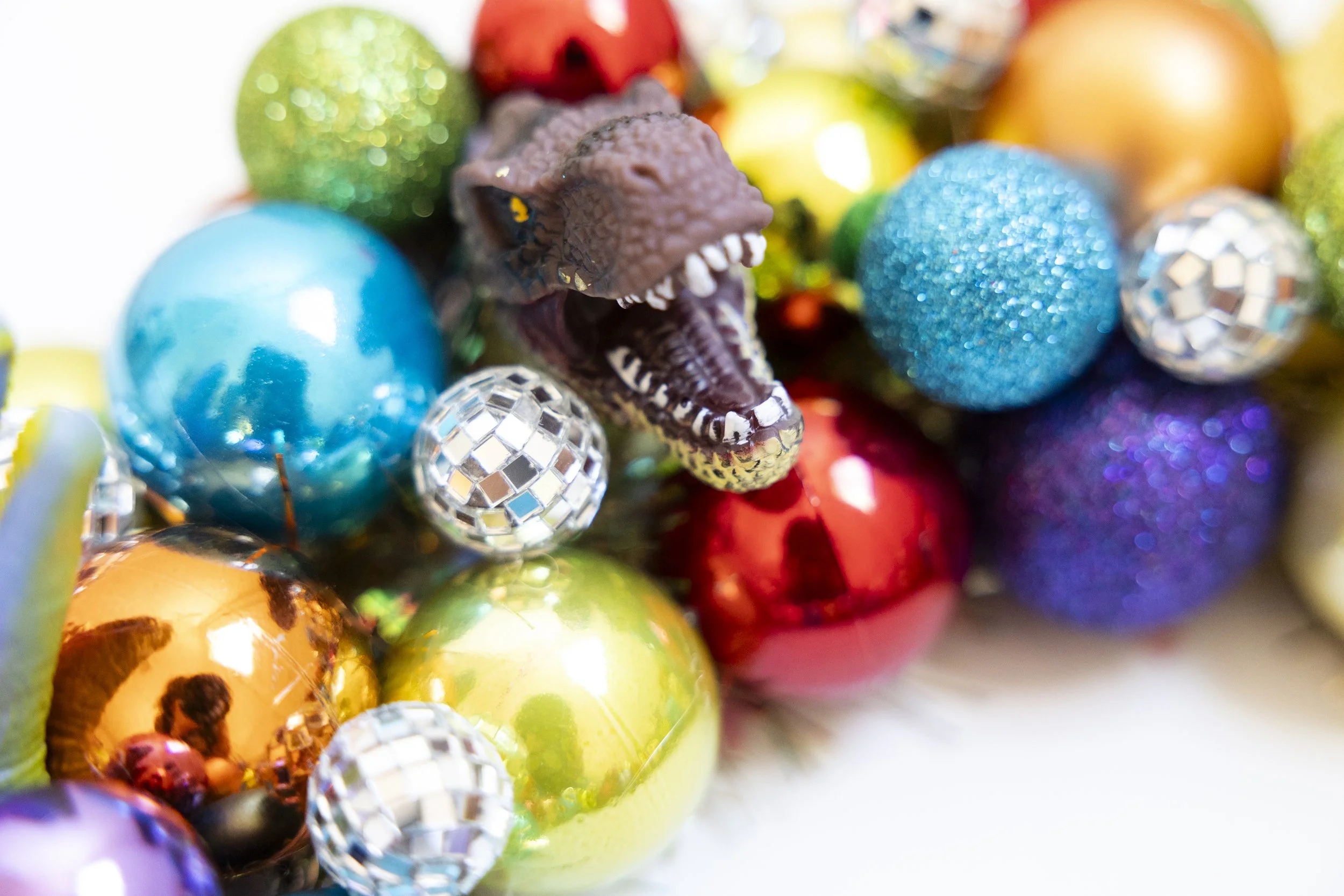 Colorful disco ball ornament wreath with T. Rex