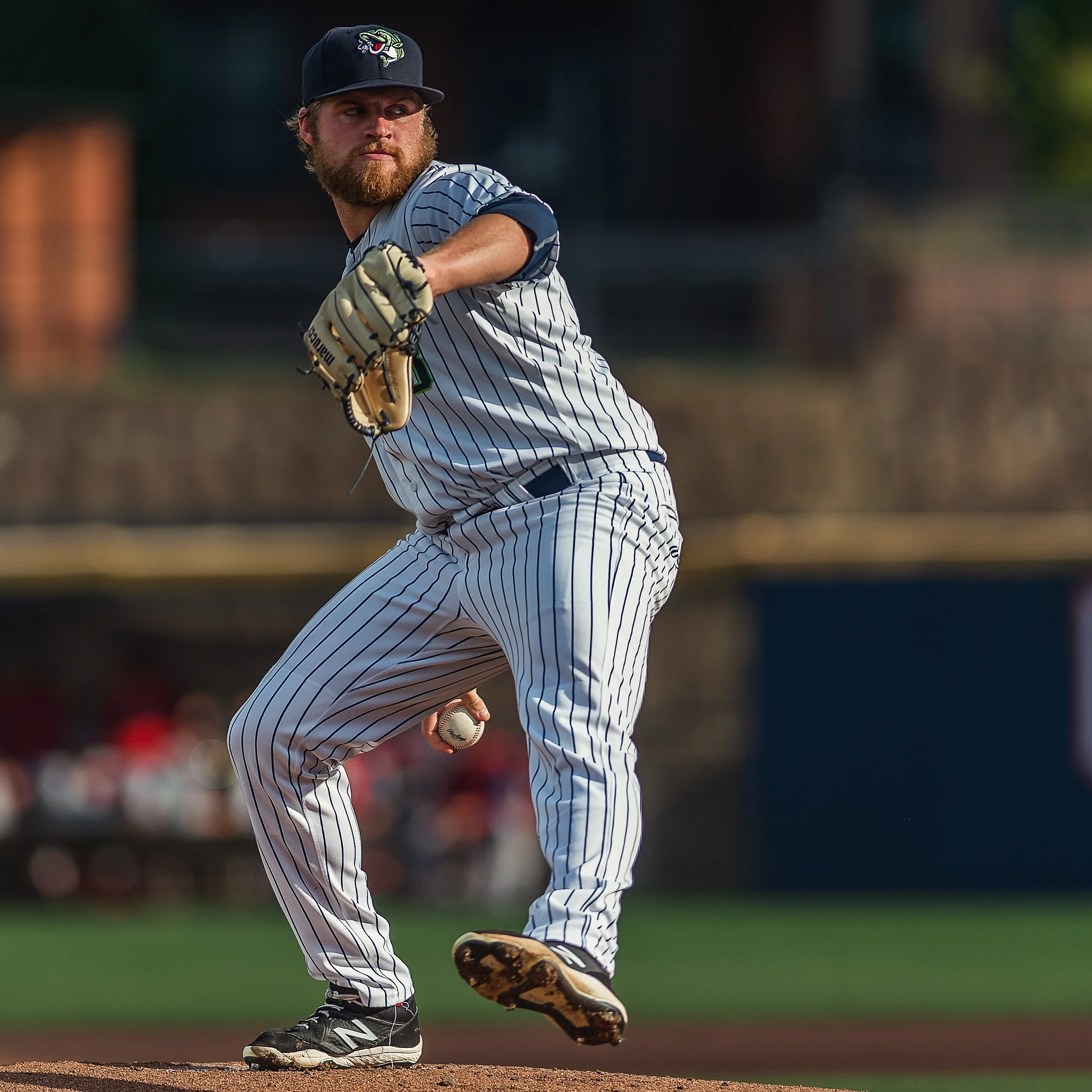 Action sports shot of Gwinnett Stripers right-handed pitcher Bryce Elder mid-delivery on the mound at Coolray Field