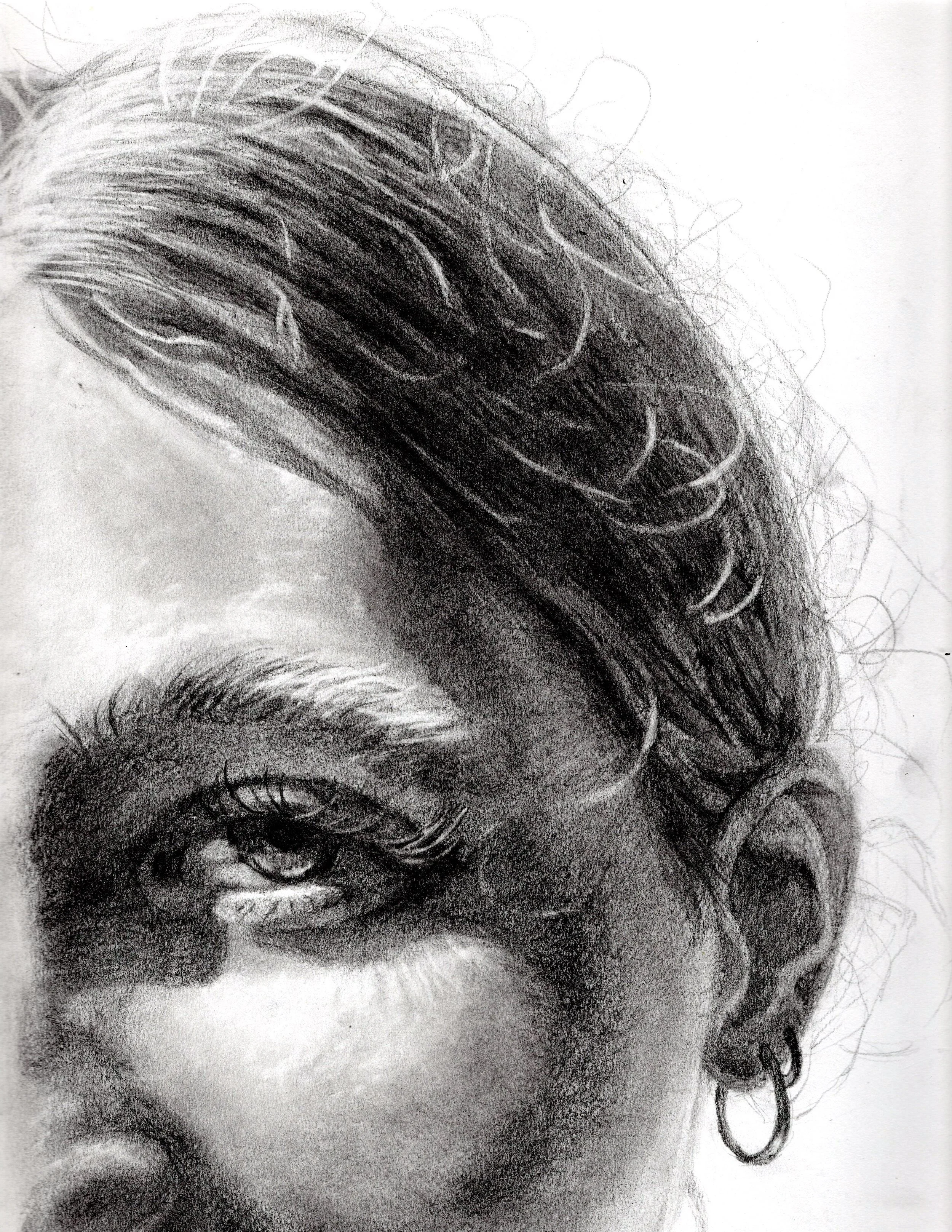 Close-up pencil drawing of a person's face, showing detailed hair, eye, and ear with a hoop earring.