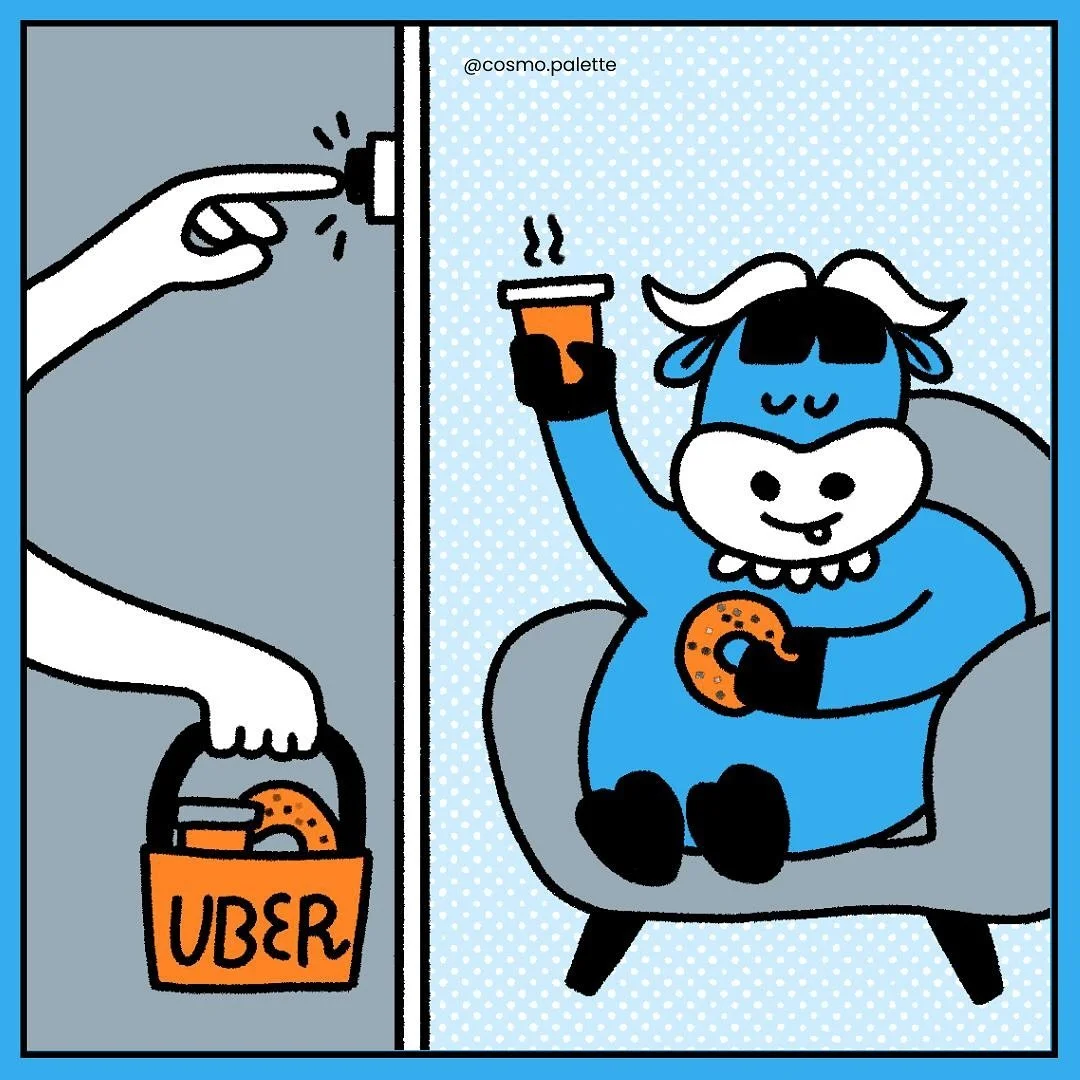 A cartoon blue cow sitting in a gray armchair, holding a steaming coffee cup in one hand and a cookie in the other, while a hand reaches through a doorway to take a bag labeled "UBER" containing cookies.