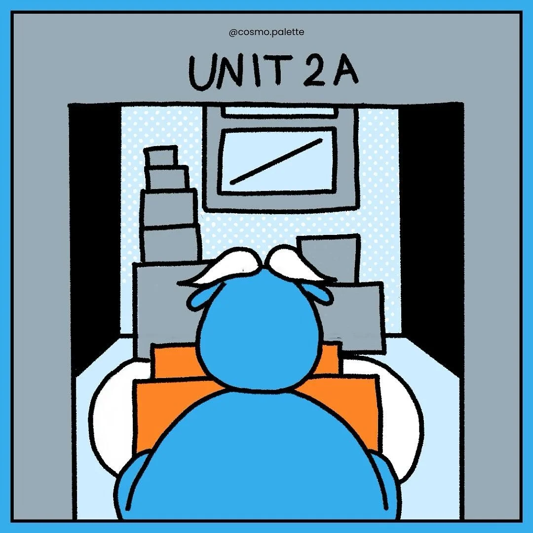 A cartoon illustration of a person sitting at a desk in a classroom labeled 'Unit 2A', viewed from behind.