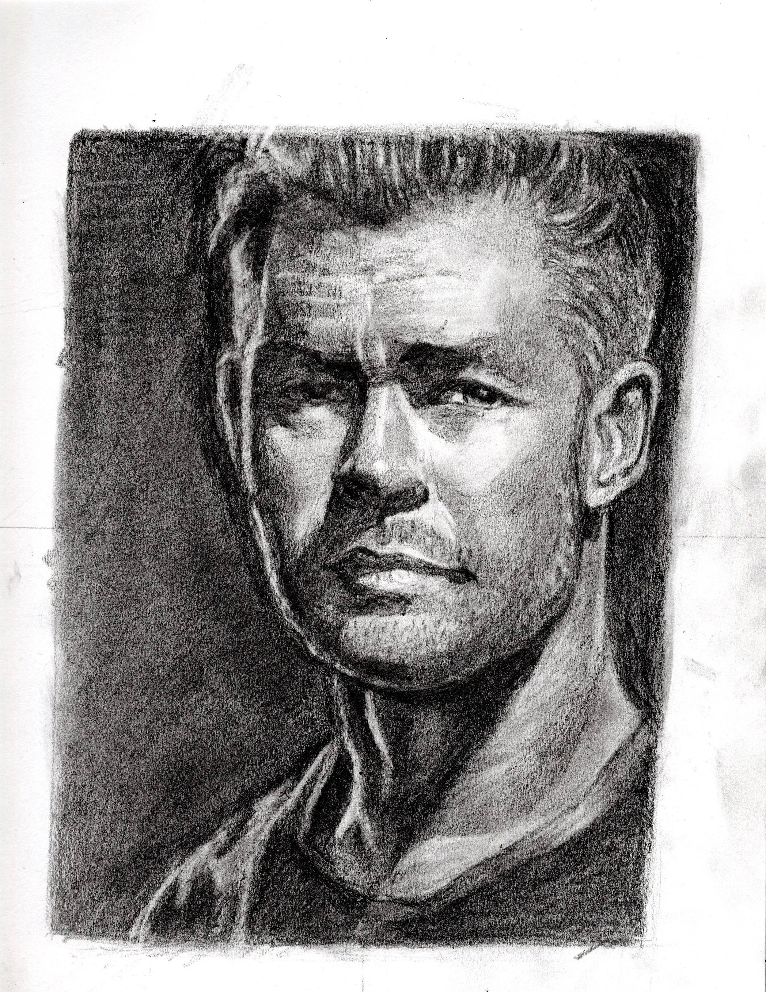 A black and white portrait of a man with a serious expression, short styled hair, and a collared shirt.