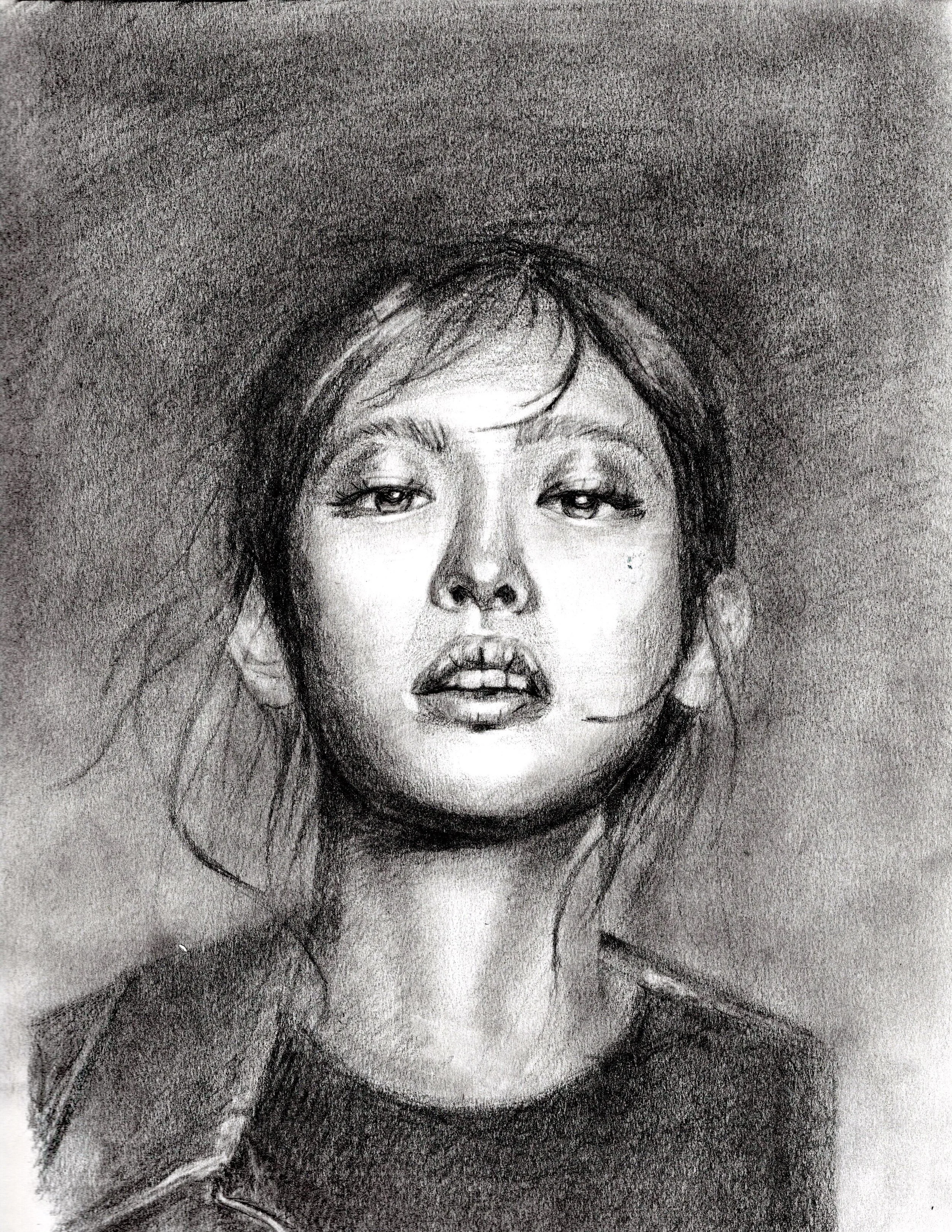 A black and white pencil sketch of a woman's face with an artistic, slightly abstract style. The woman has long hair, expressive eyes, and slightly parted lips.