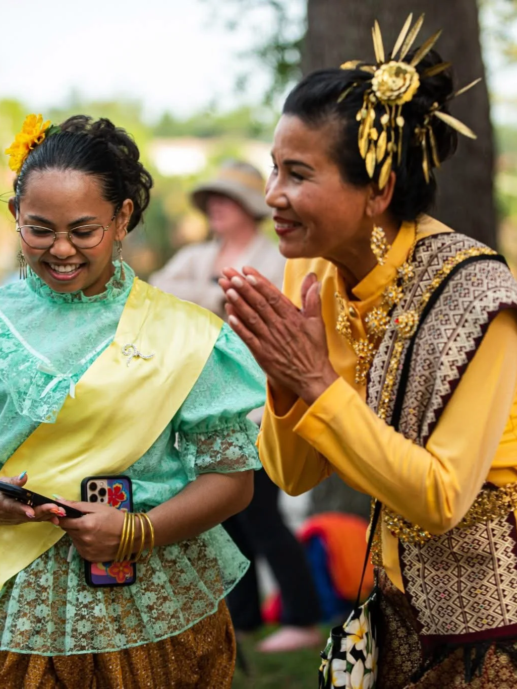 Performers in traditional Thai attire participating in the Discover Asia Festival at McKenzie Park in downtown Panama City, Florida.