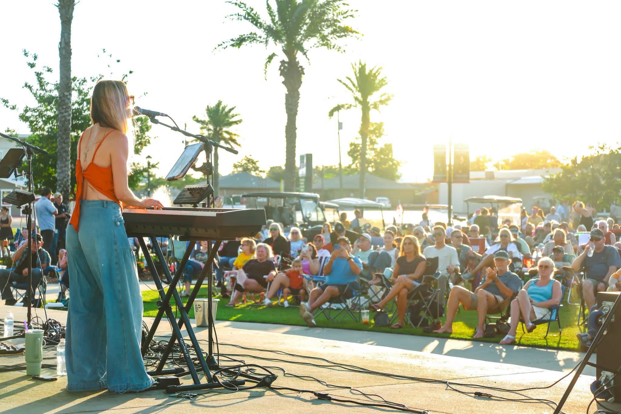 Musician performing at free community concert in a public park in Lynn Haven, Florida.