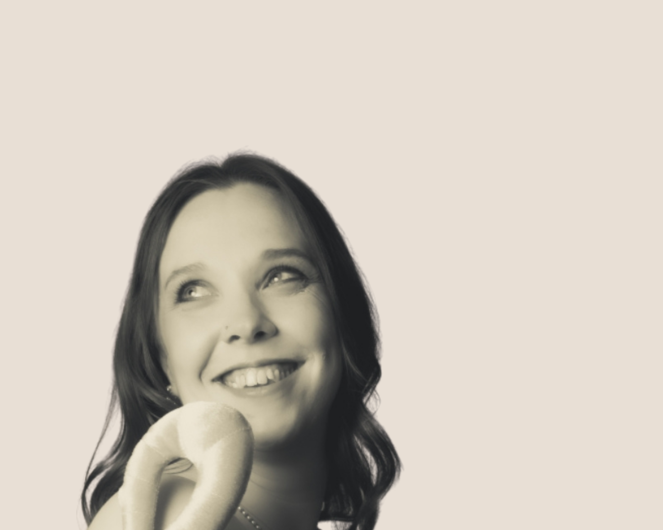Black and white portrait of Fiona Corless, founder of FL Collaborative Consulting, smiling, looking up and to the side. Representing her authenticity in her mission to help small businesses and charities navigate NHS and local authority commissioning
