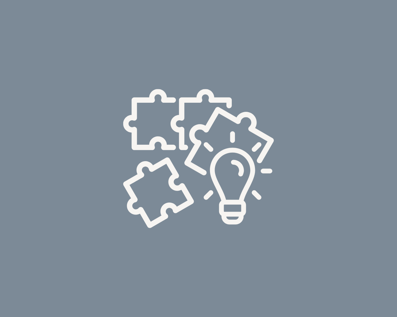 Puzzle pieces and light bulb icon on a slate blue background, representing clarity around commissioning, funding opportunities and public sector requirements.