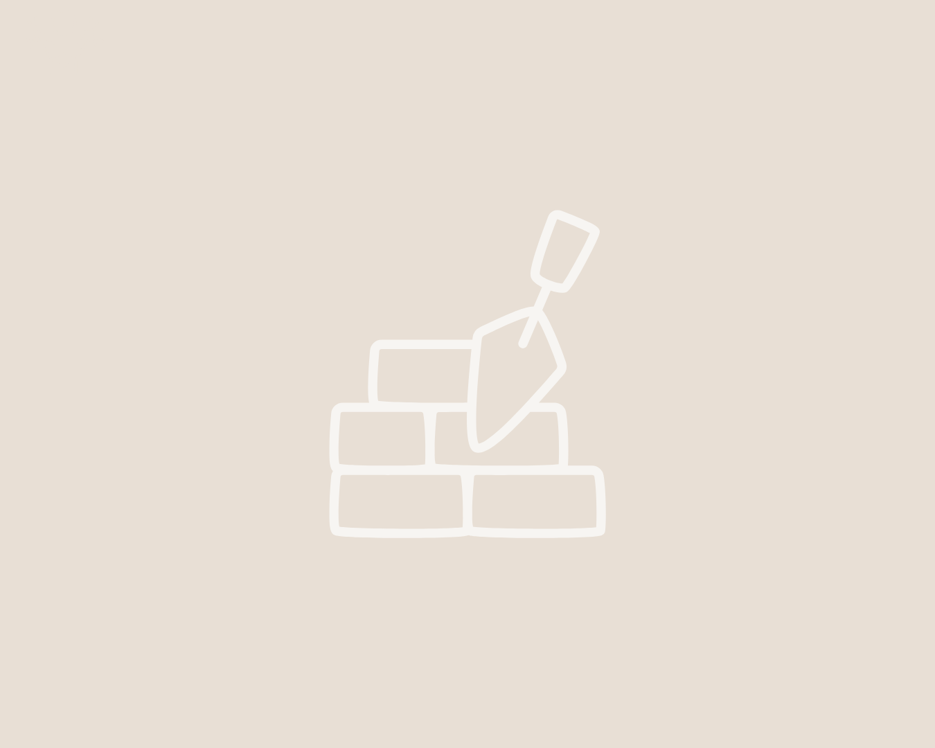 Outline of a trowel sticking out of a stack of bricks, representing confidence in communicating impact and building commissioner relationships.