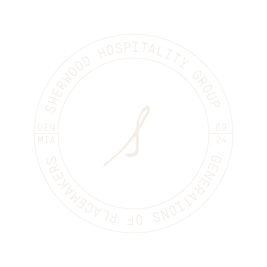 Circular logo for the Palmetto Lawyers of the Sherwood Hospitality Group, with a stylized leaf or feather in the center, and the location abbreviations DEN, MTA, and others around the circle.