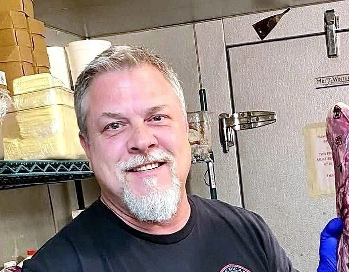 Casey Hanlon getting ready to smoke brisket.