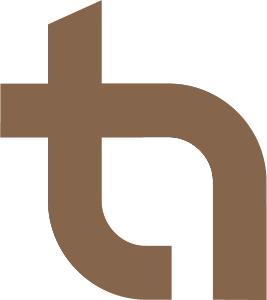 Close-up of a large brown lowercase letter 'a' on a black background.