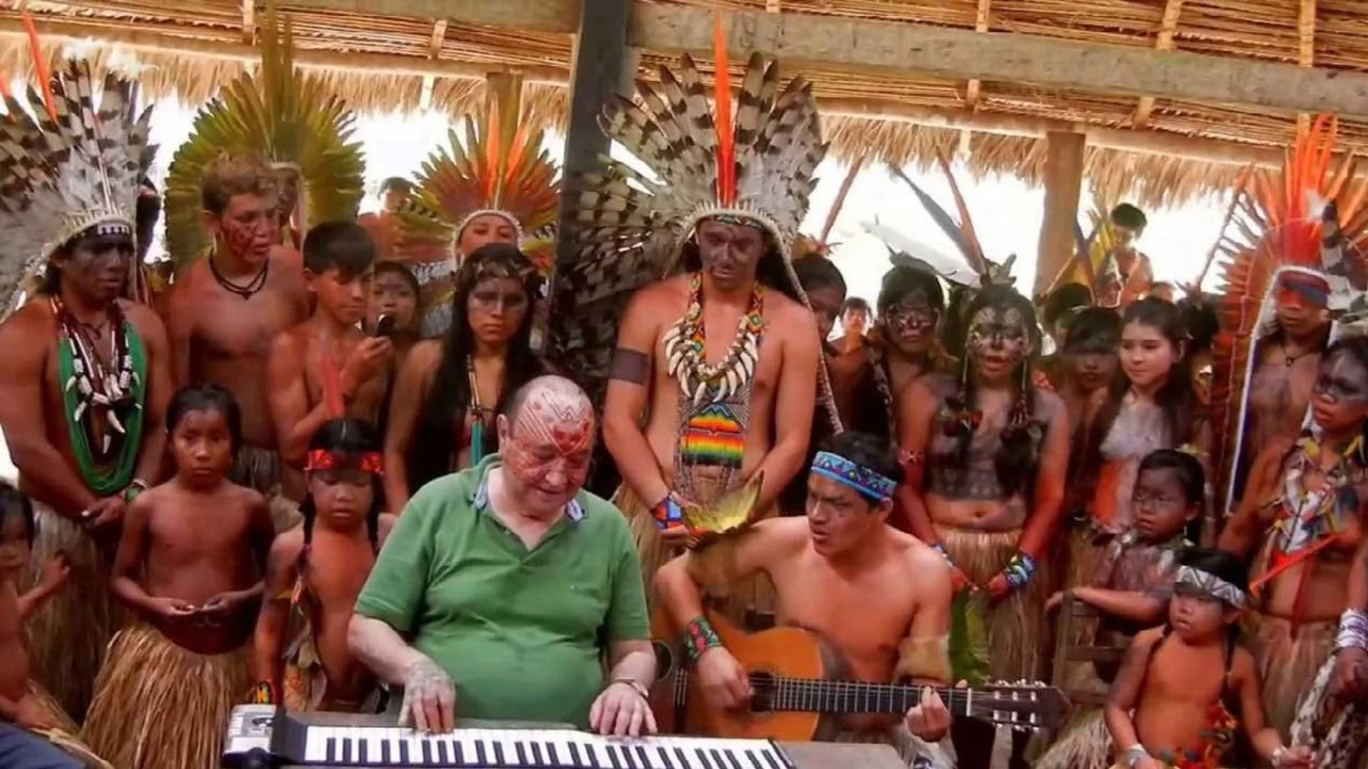 João Donato playing keyboards with indigenous people